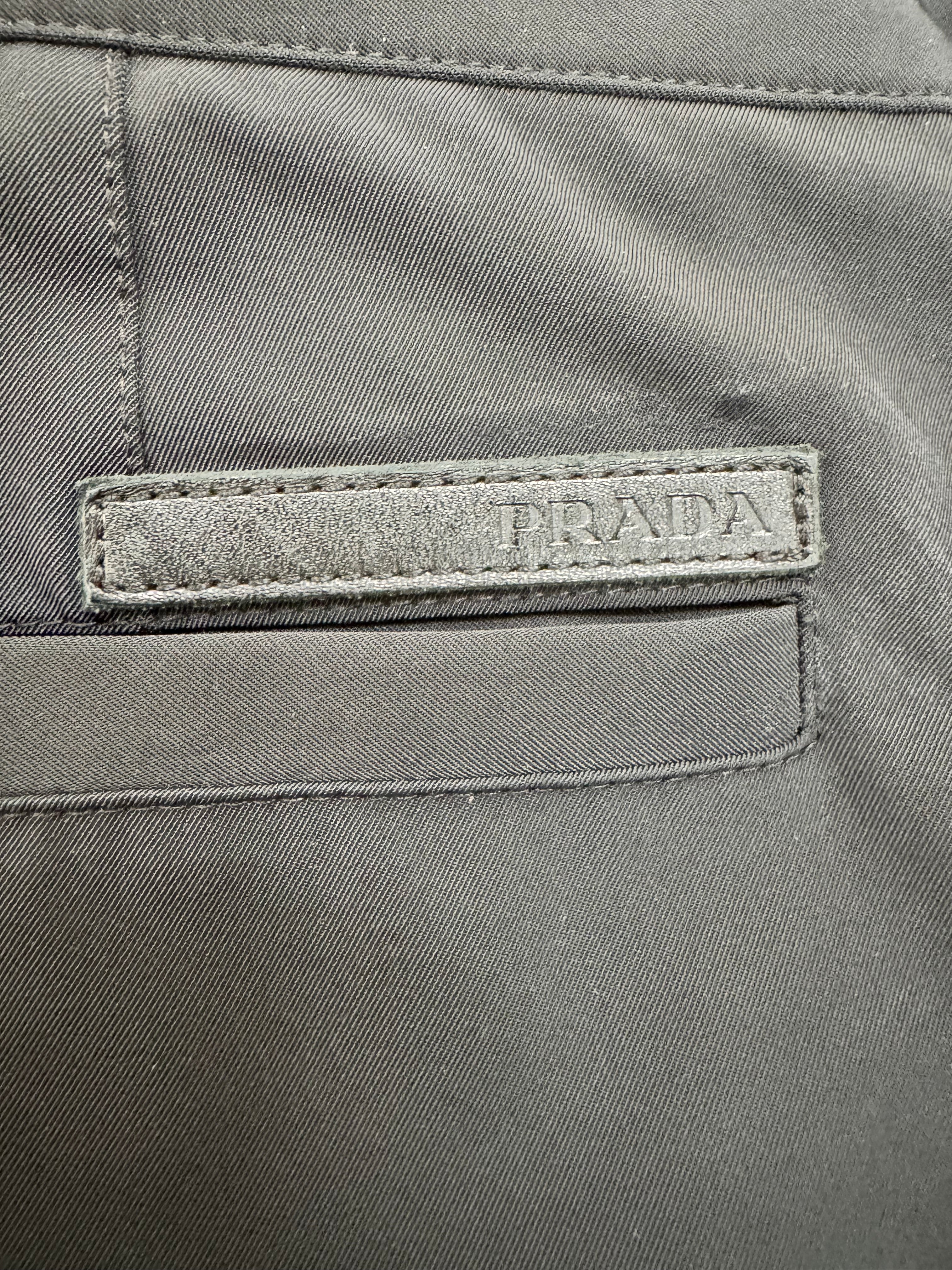 Close-up of a Prada label on a gray fabric background