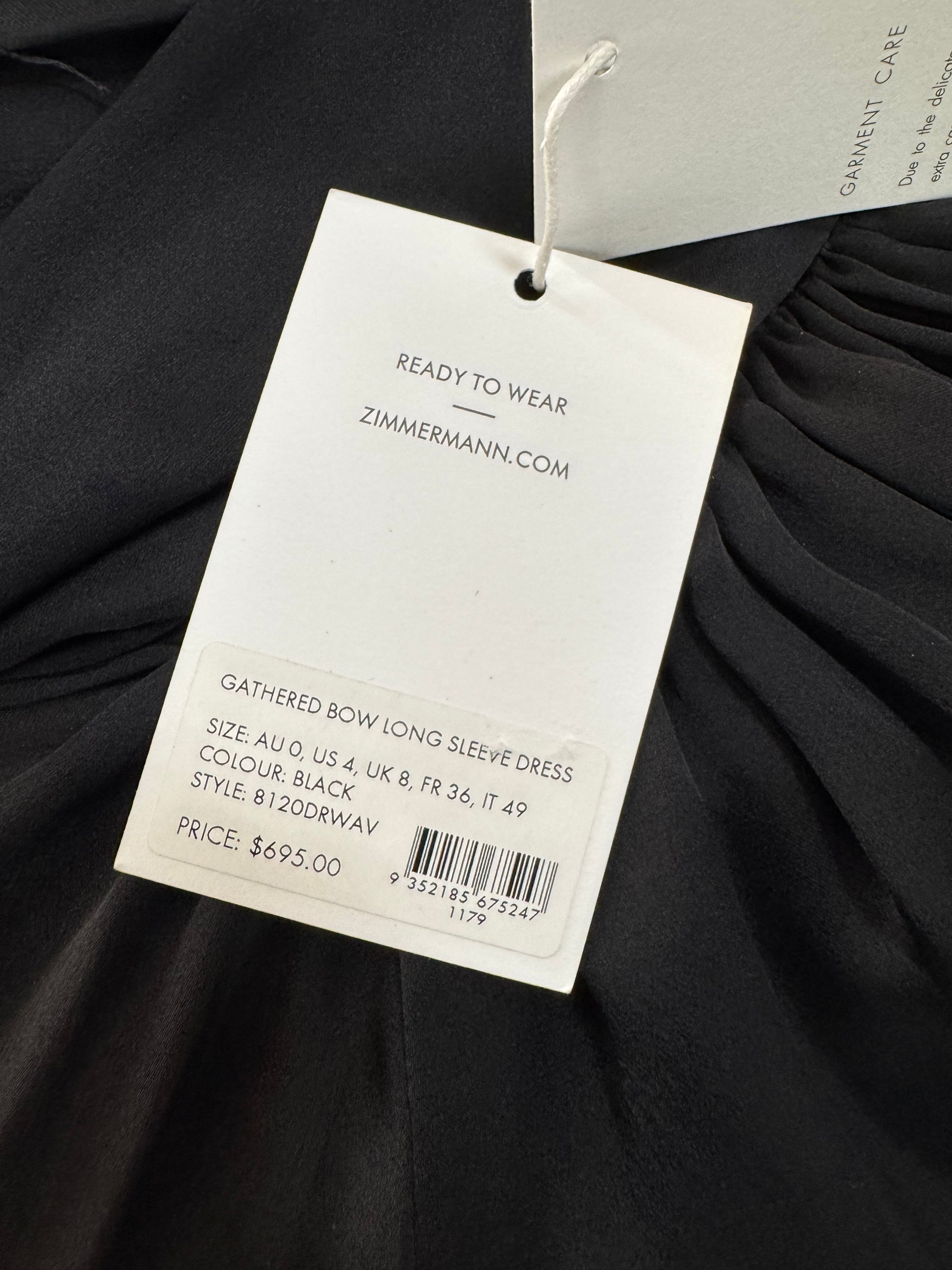 Black garment with a Zuhair Murad tag on a dark background