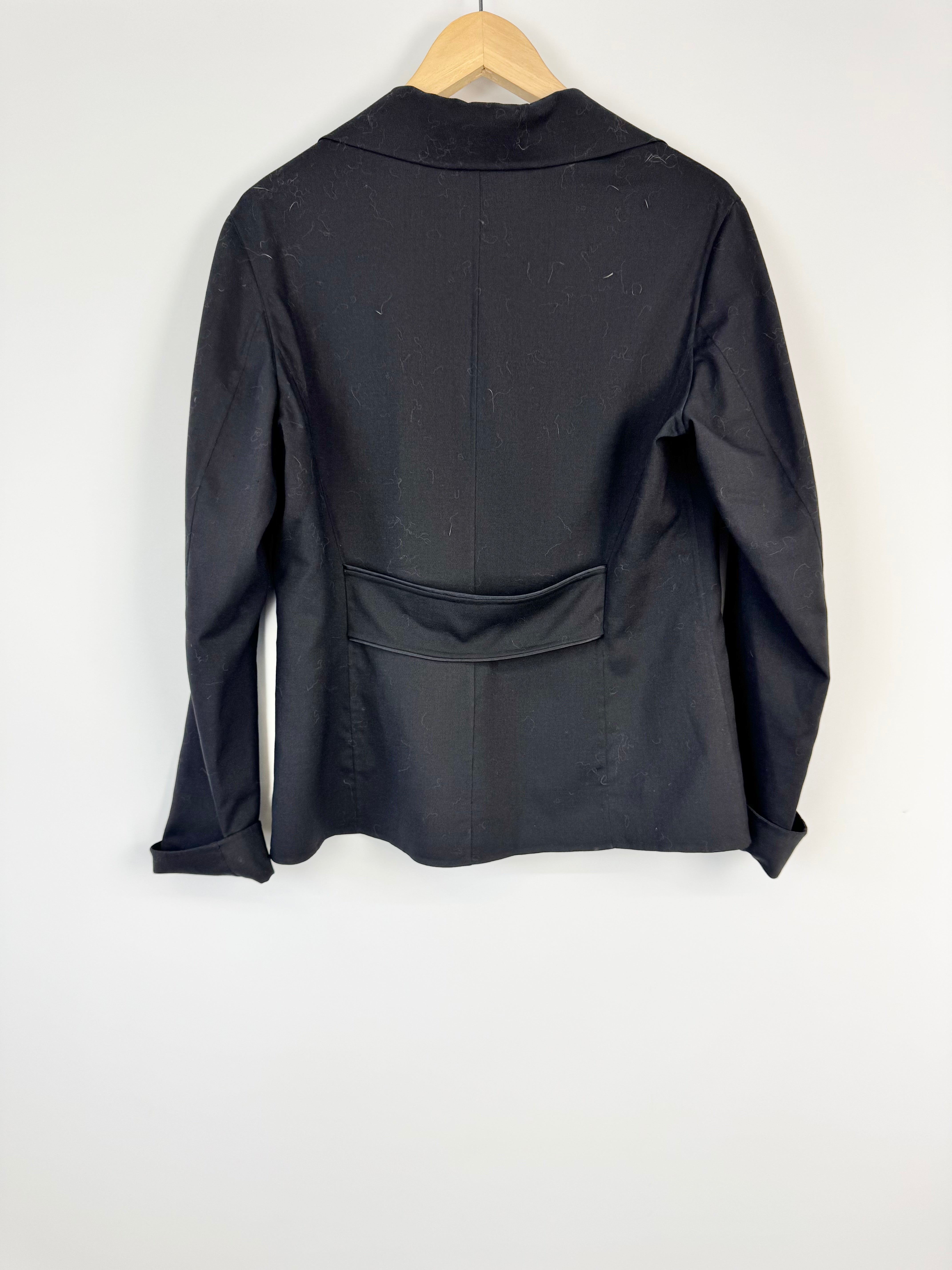 Black jacket on a hanger against a white background