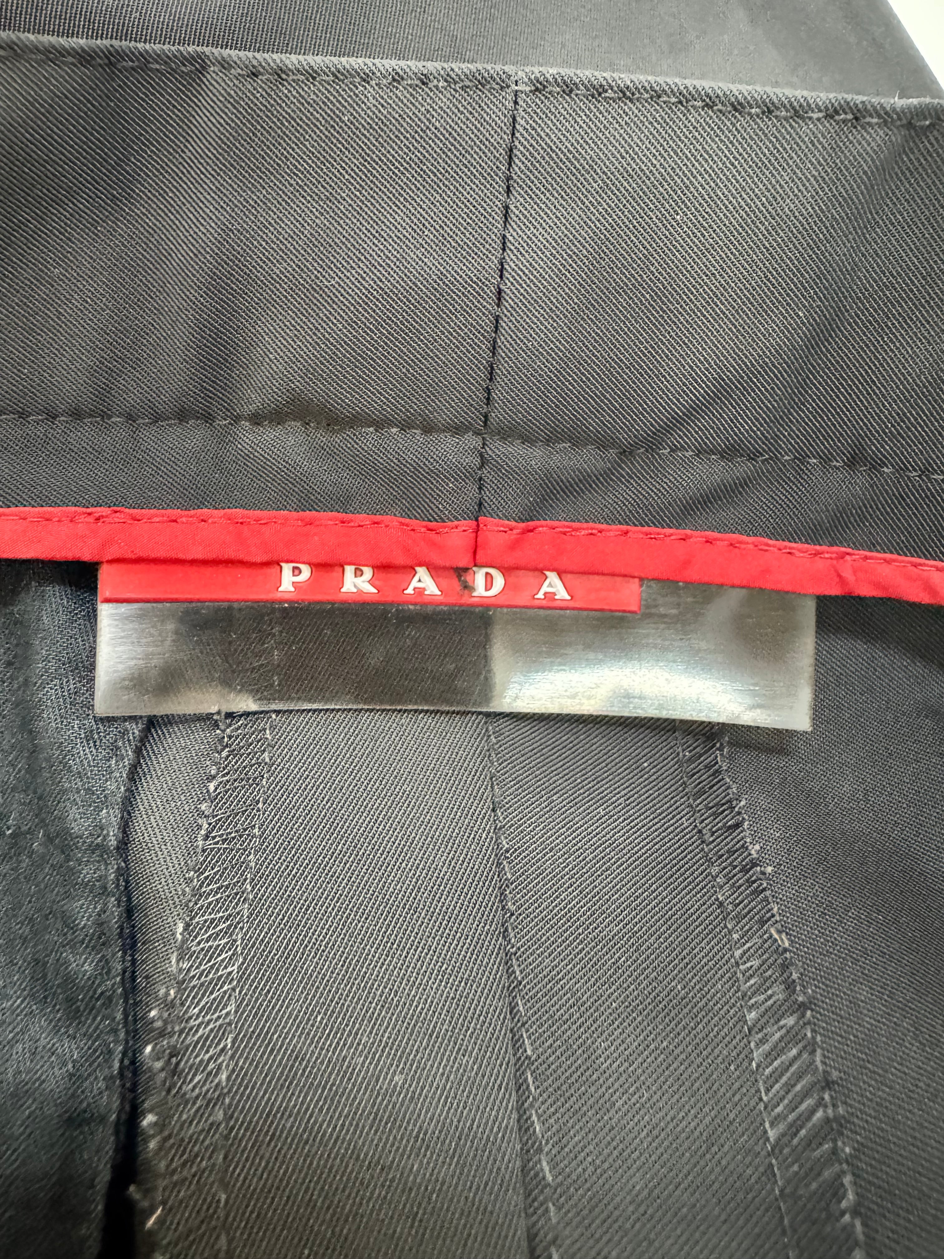 Close-up of a Prada label on a gray fabric background