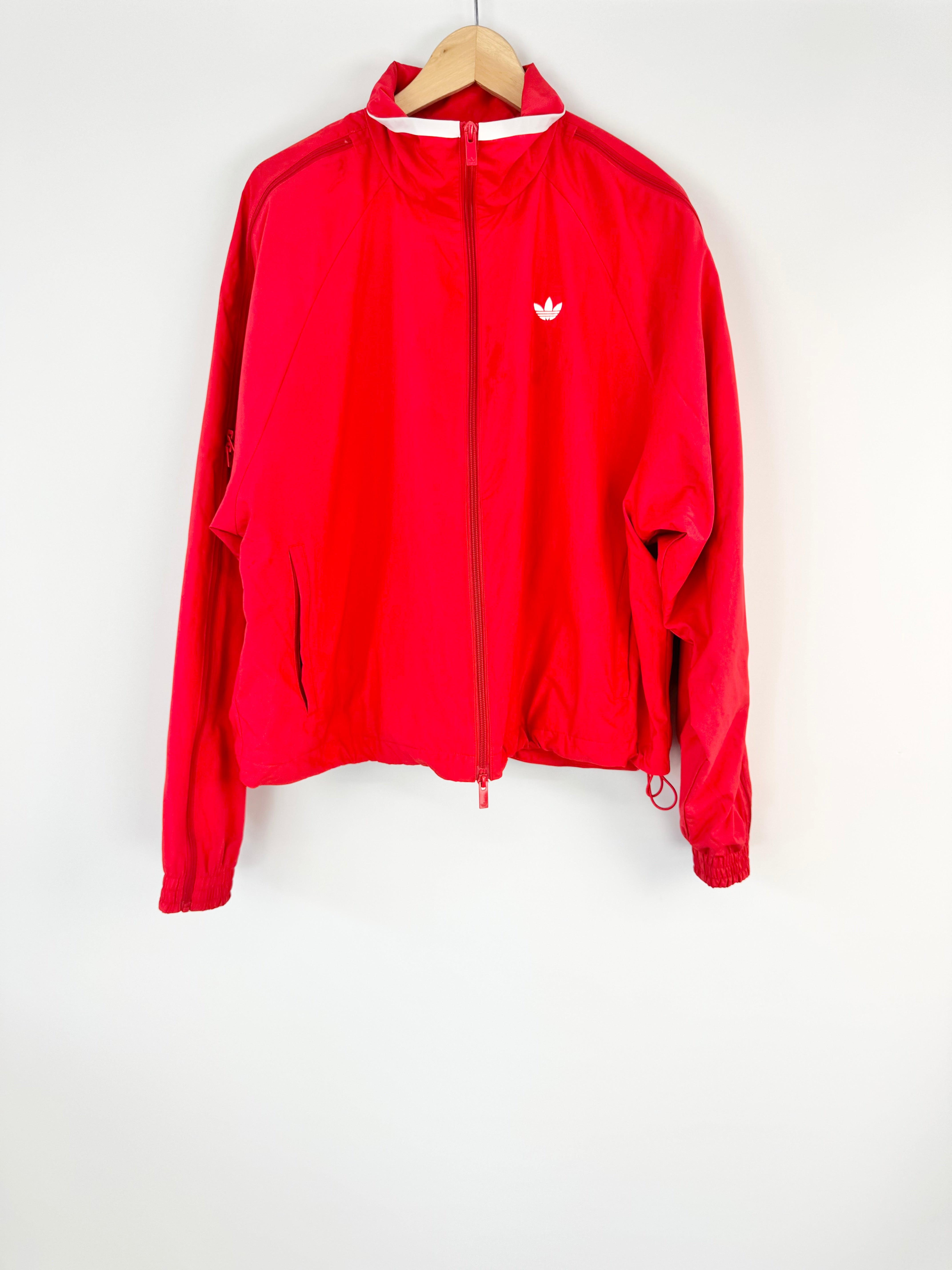Red jacket with a brand logo on a white background