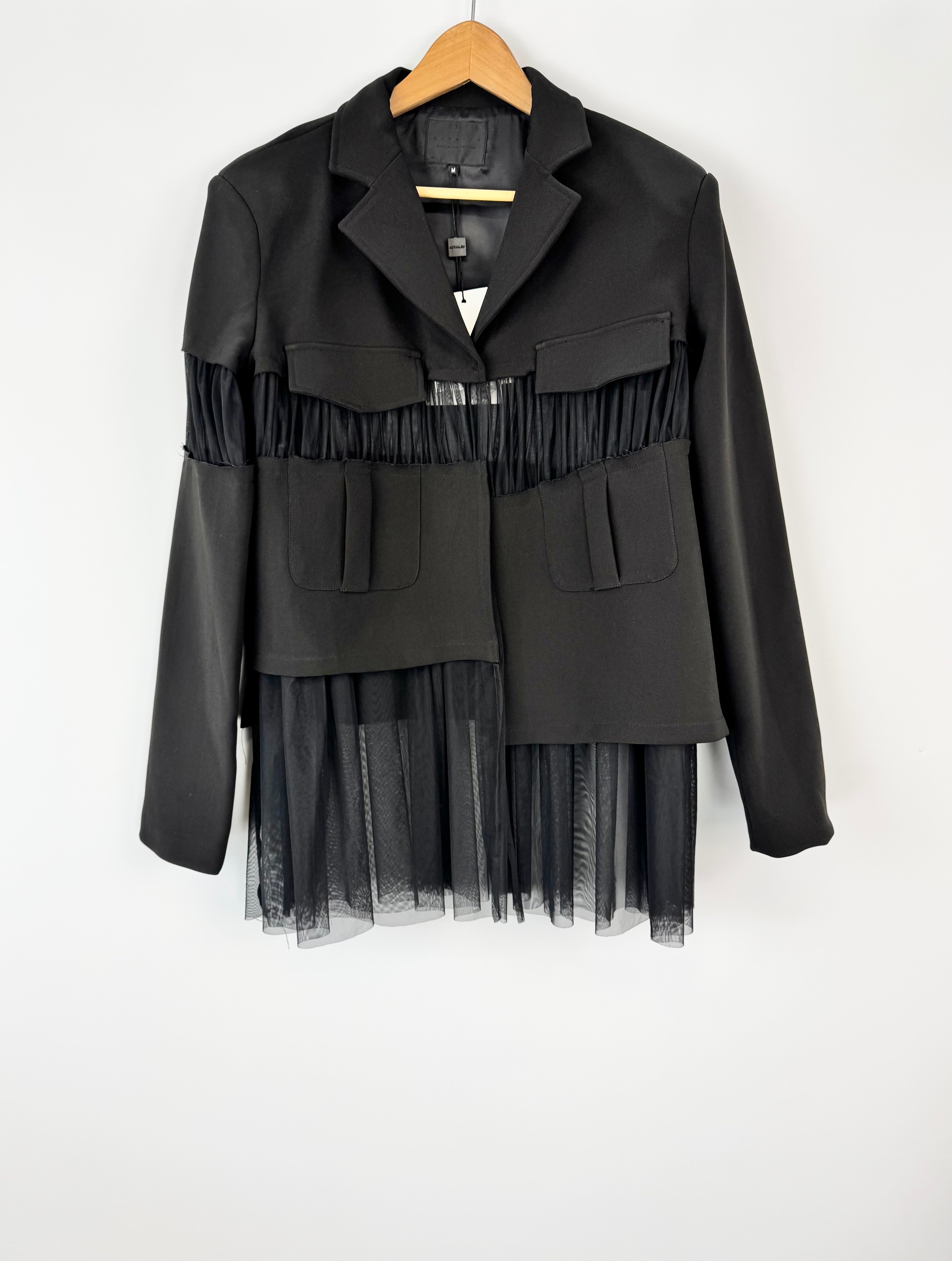 Black jacket with layered design on a white background