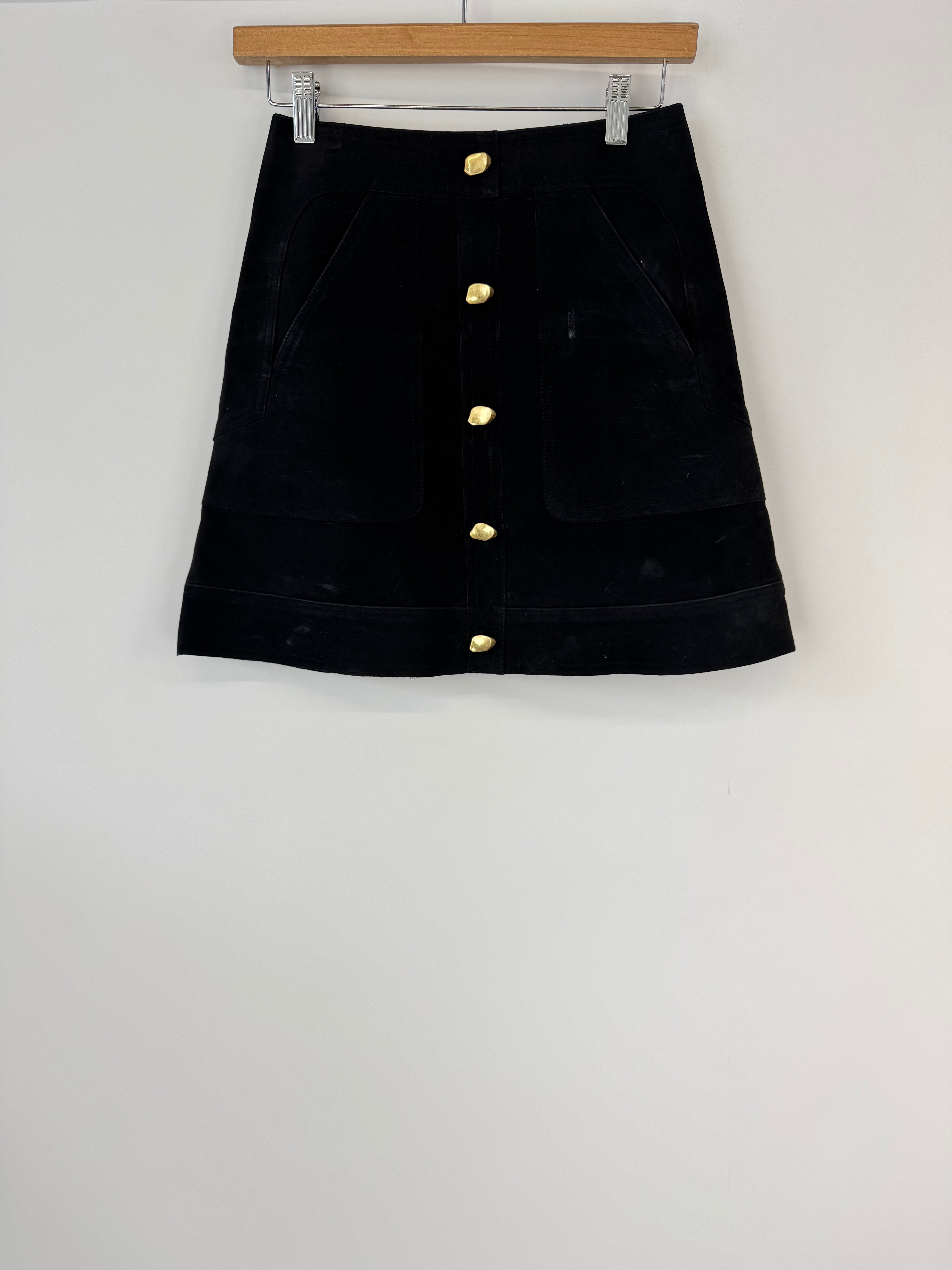 Black jacket with gold buttons on a white background