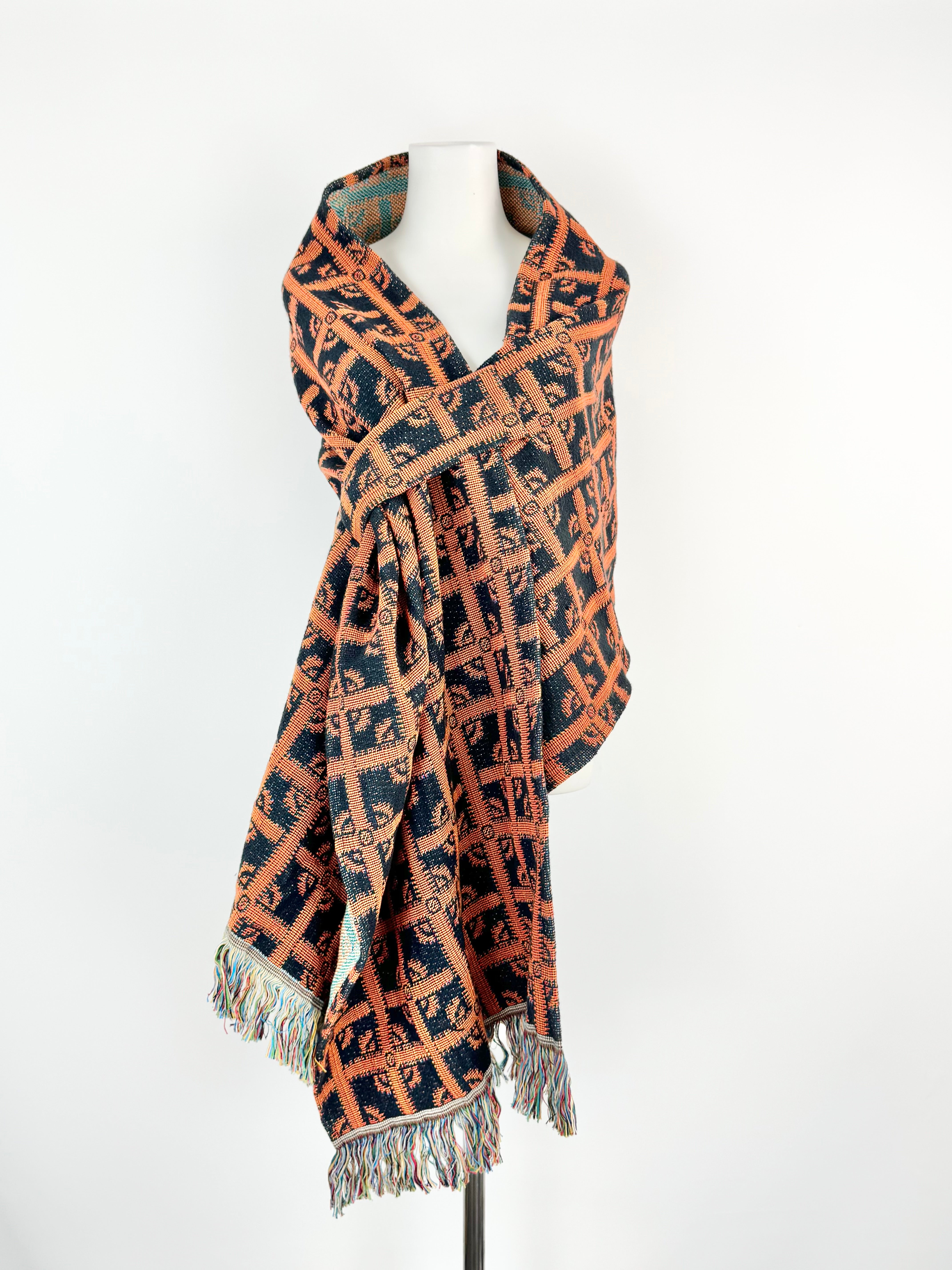 Patterned scarf with fringes on a white background