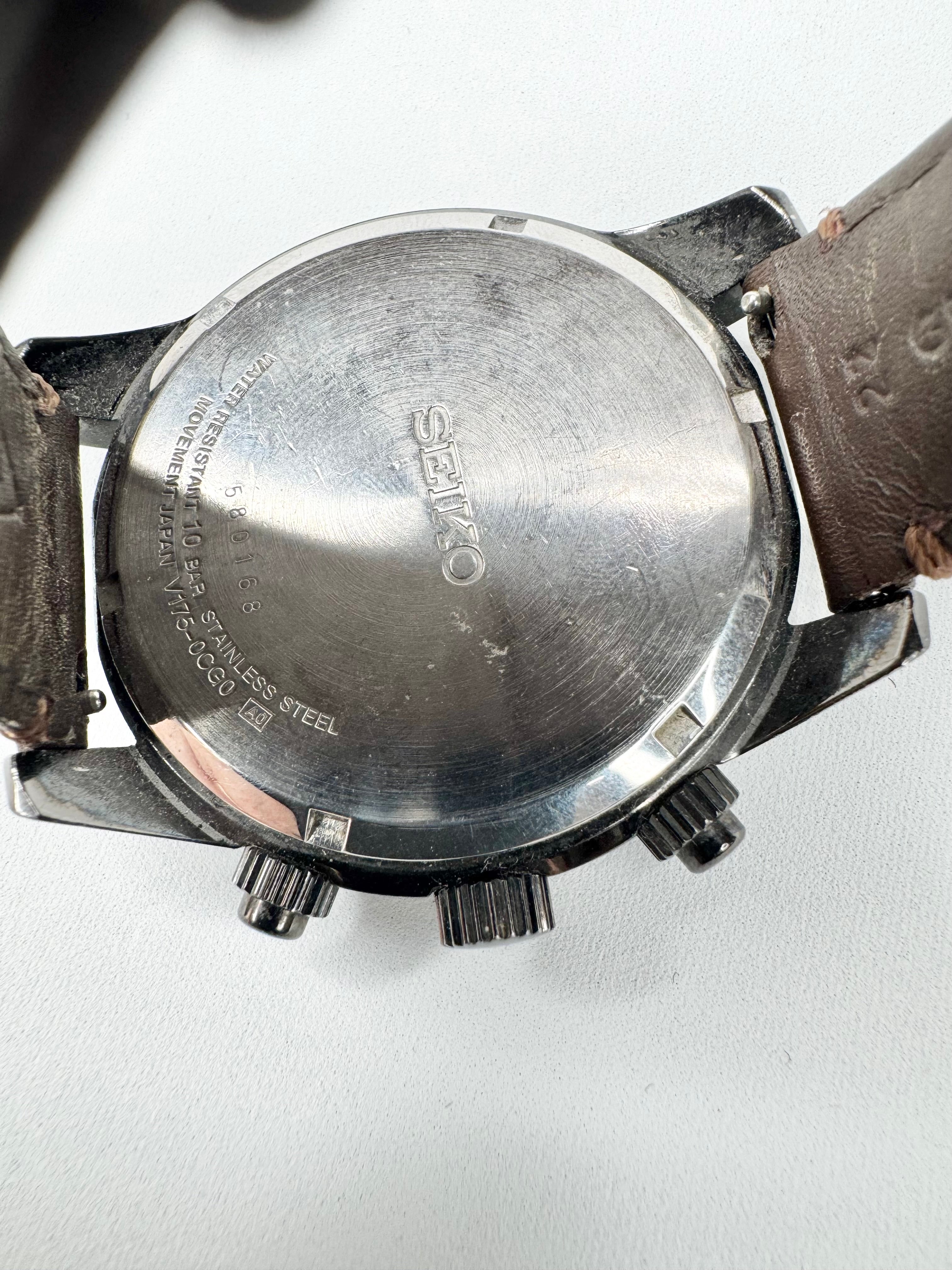 Close-up of a Seiko watch back cover on a white background