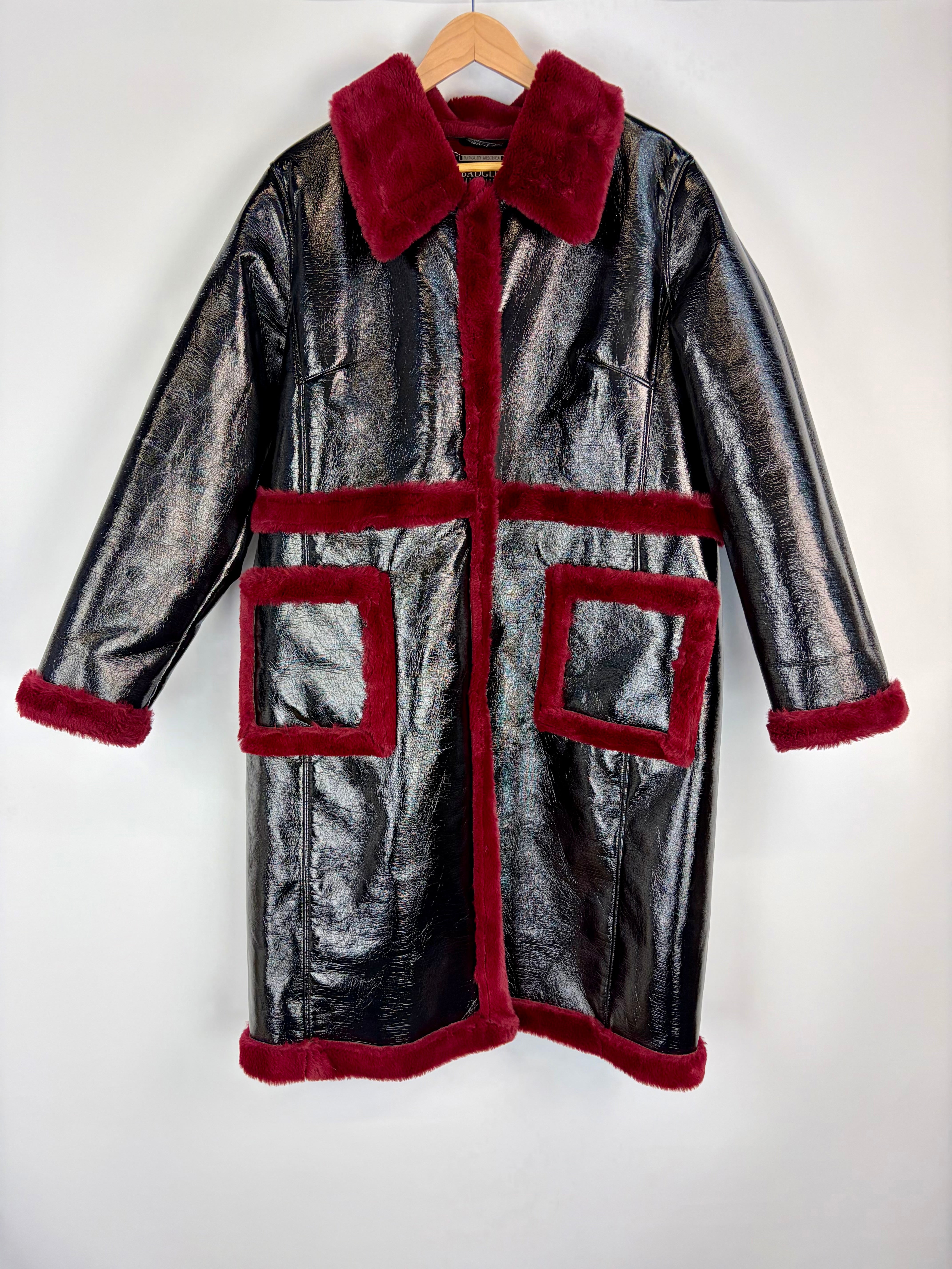 Silver coat with red fur trim on a white background
