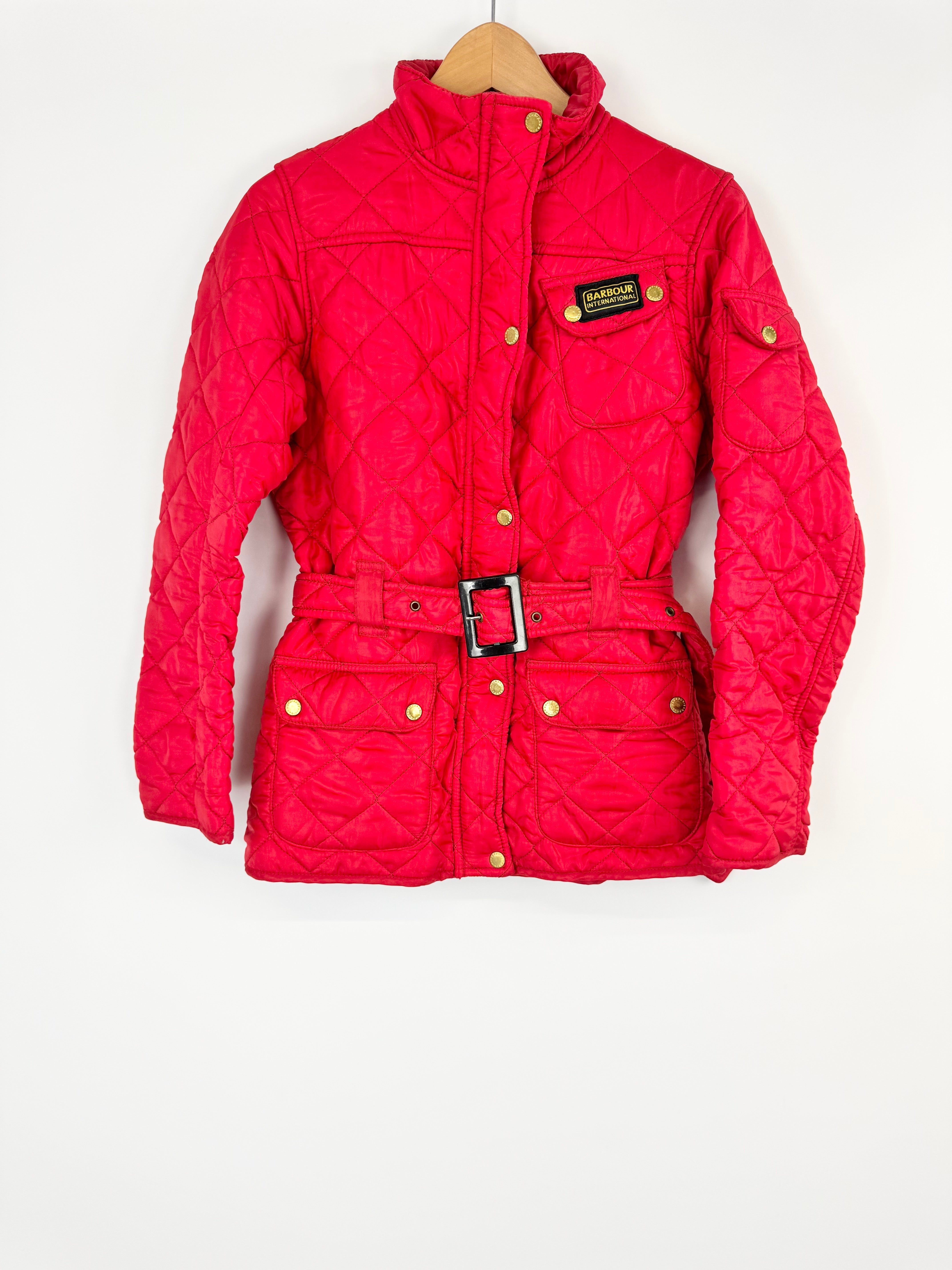 Red quilted jacket with a brand logo on a white background