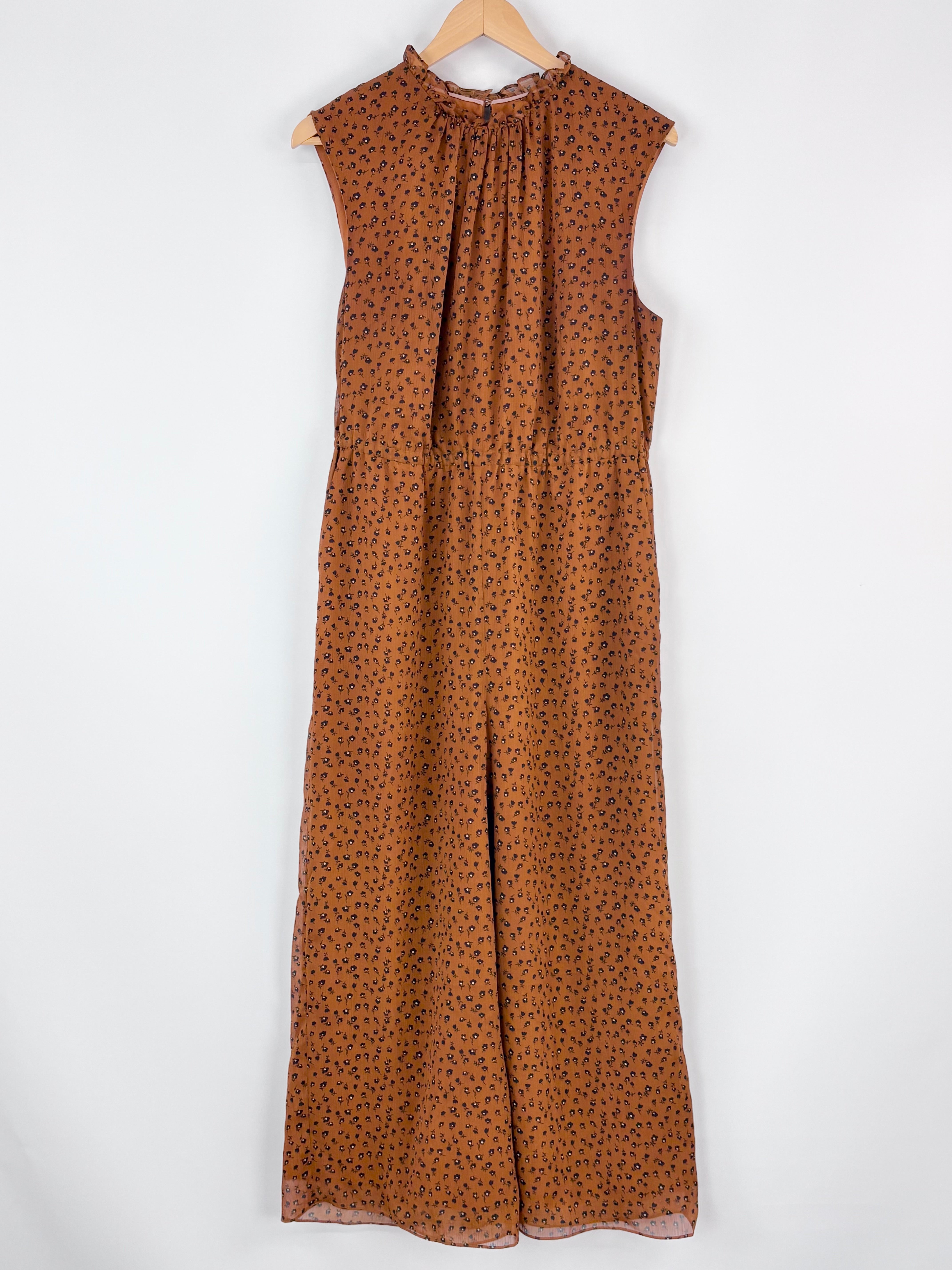 Brown sleeveless dress with a pattern on a white background