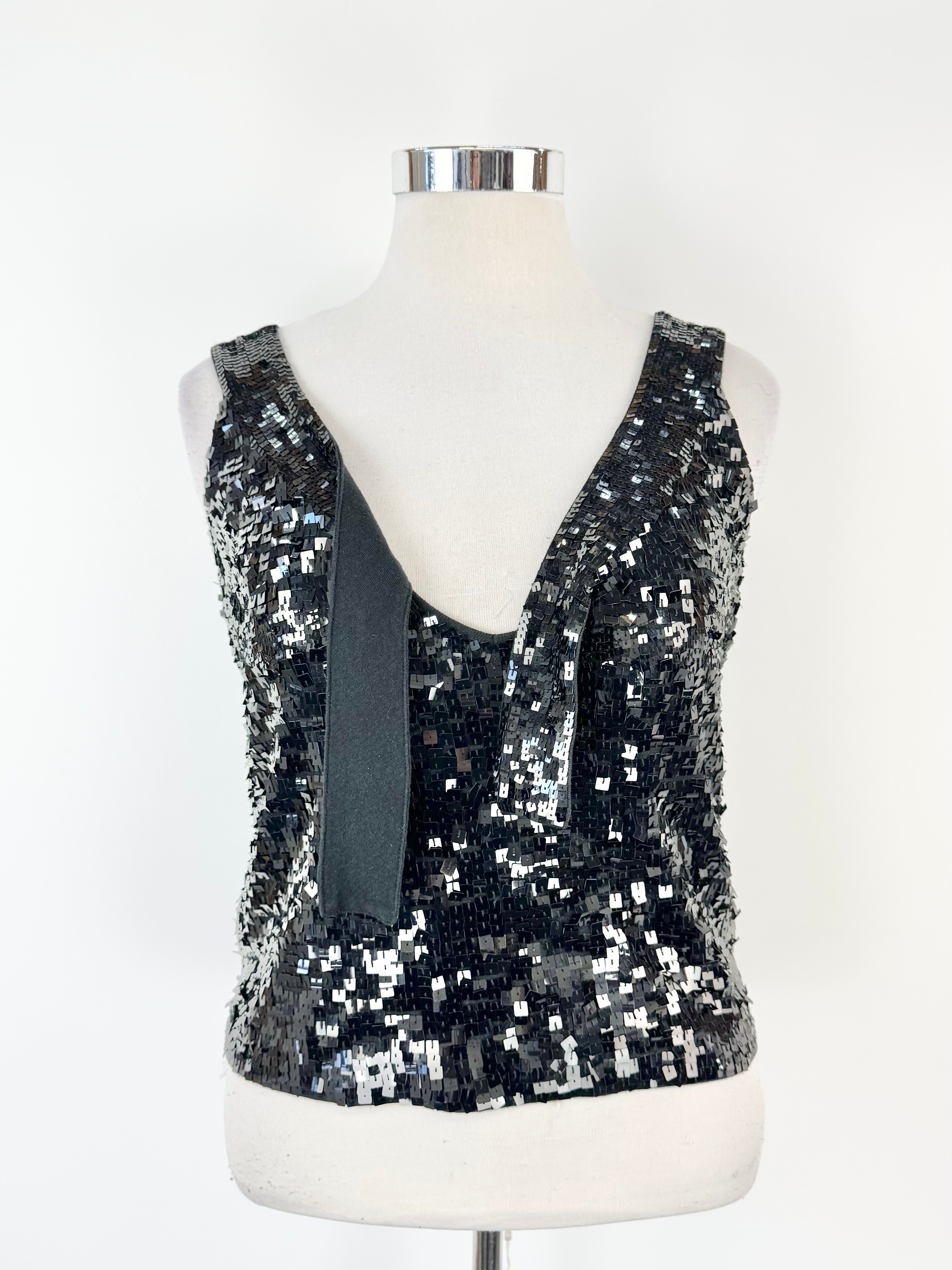 Black sequin top on a mannequin against a white background