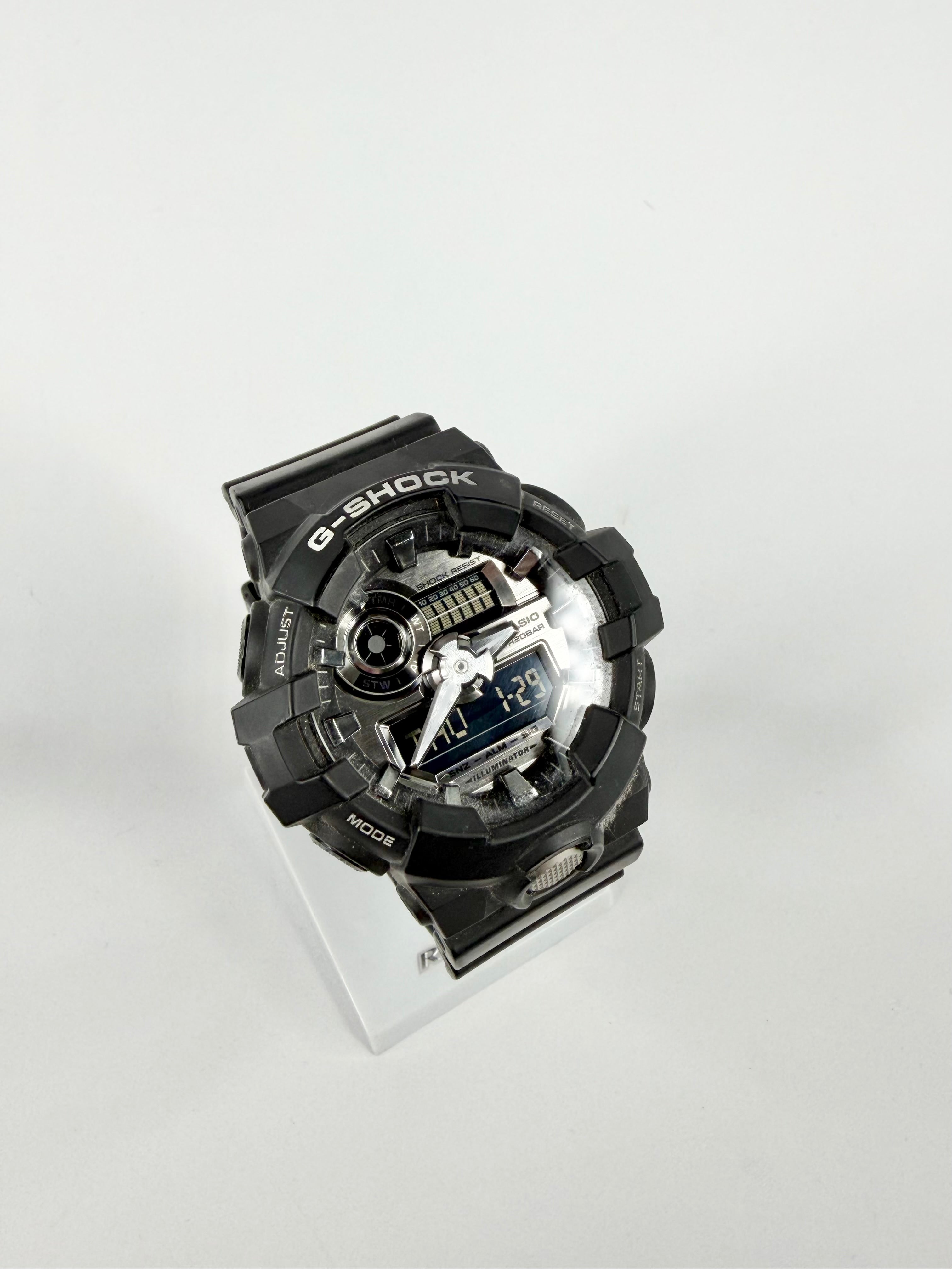 Black mechanical component on a white background