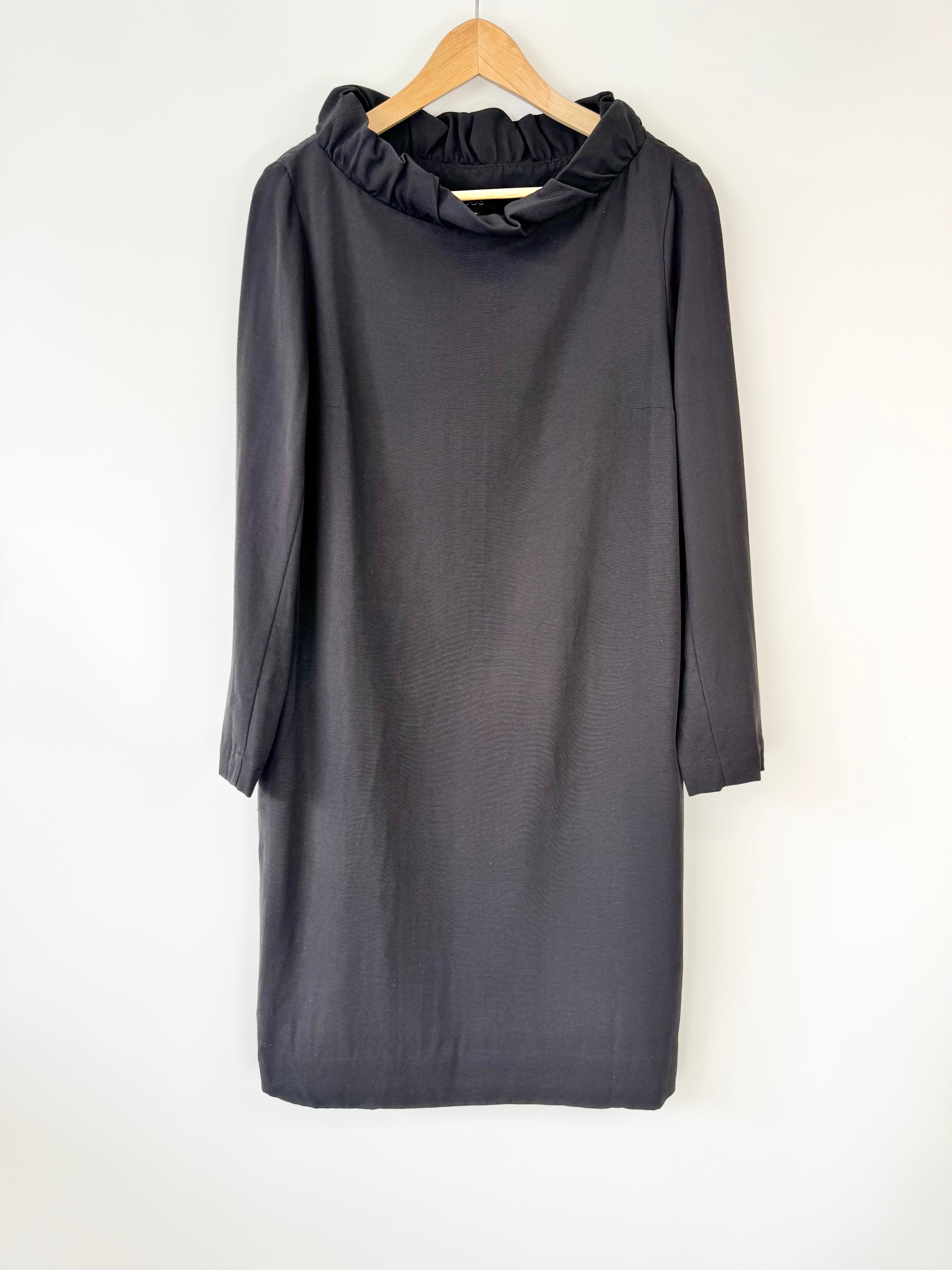 Gray dress on a hanger against a white background