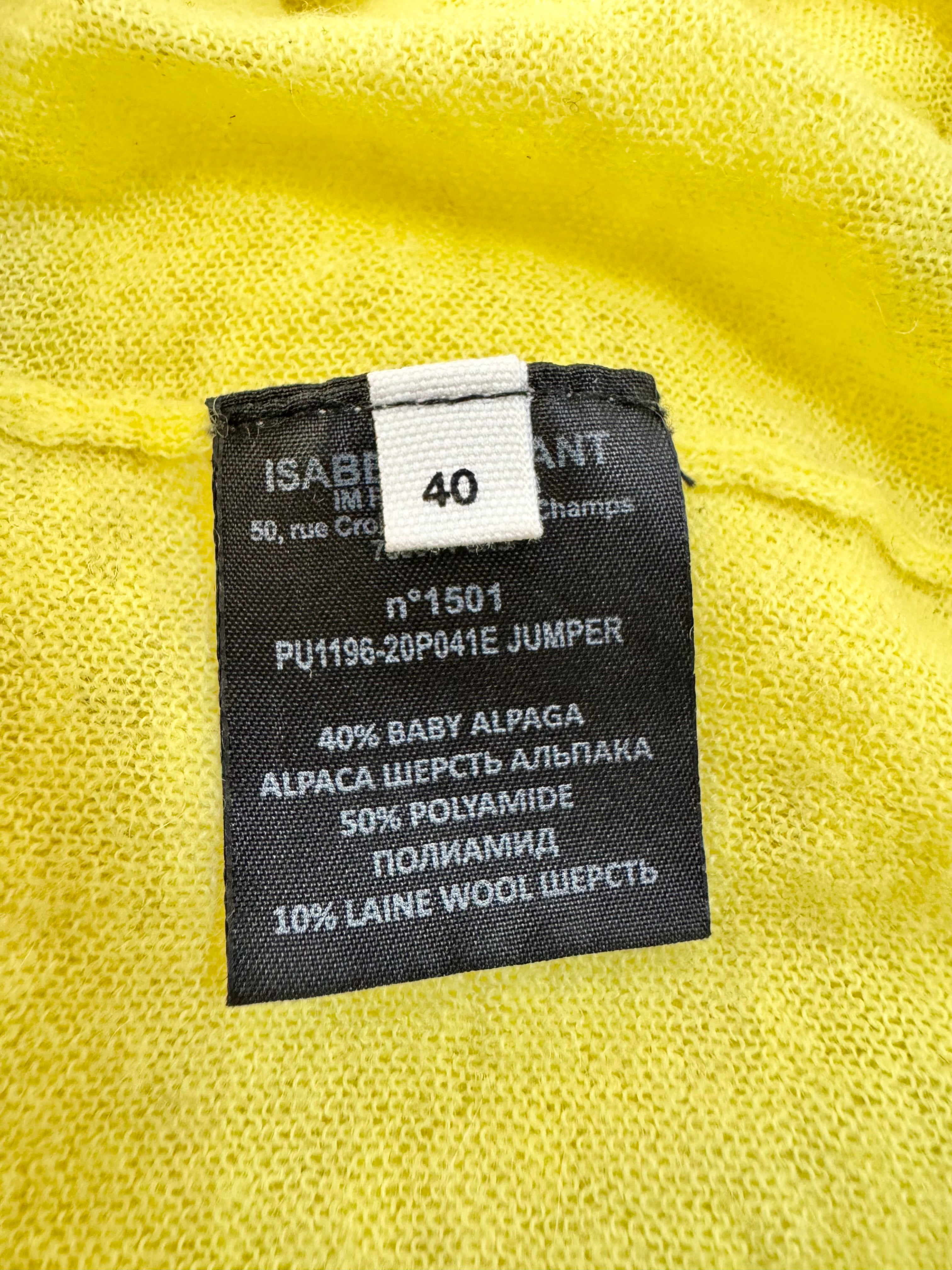 Clothing label on a yellow garment with brand and size information.