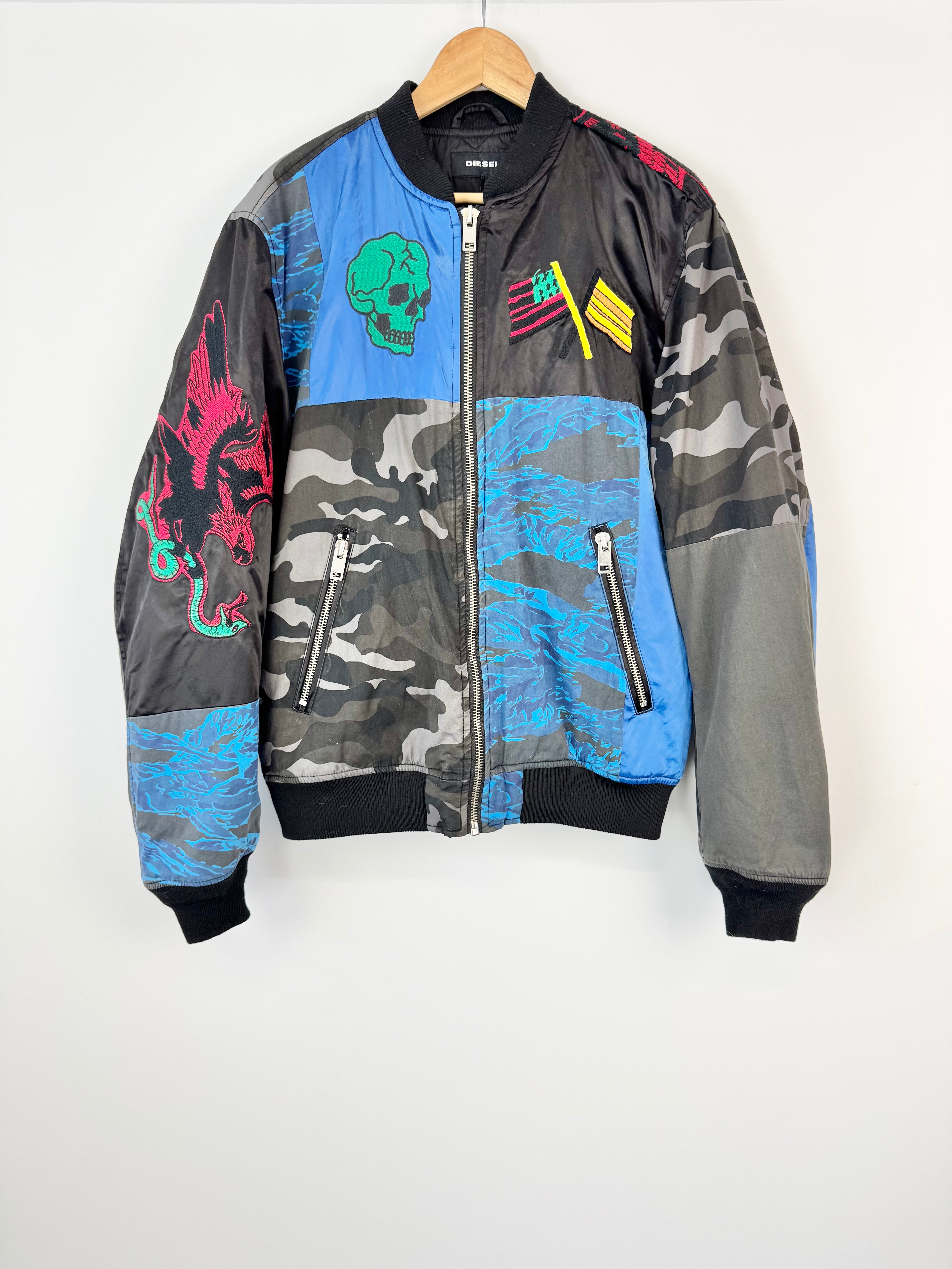 Multicolored bomber jacket with graphic designs on a white background