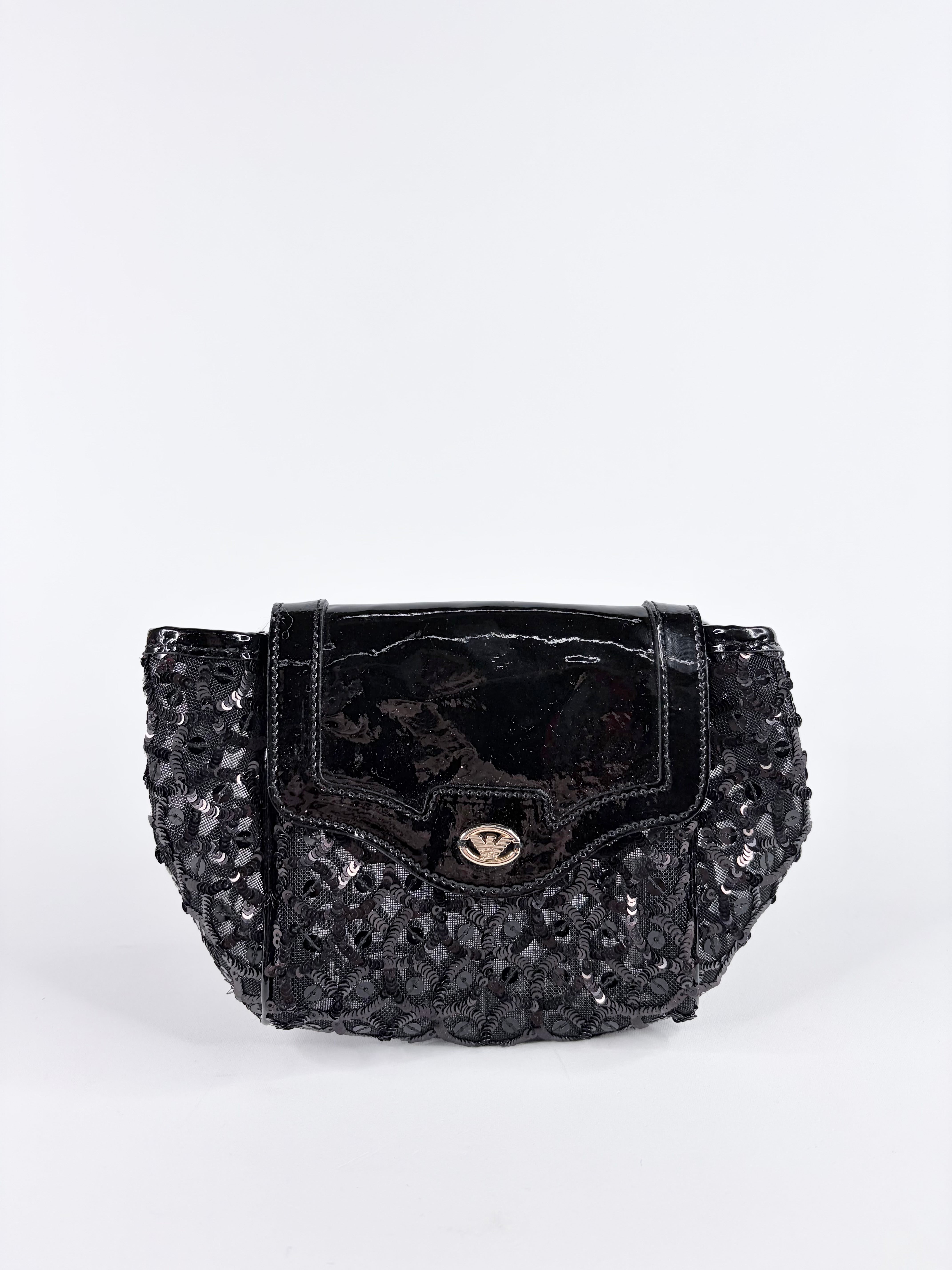 Black sequined handbag on a white background
