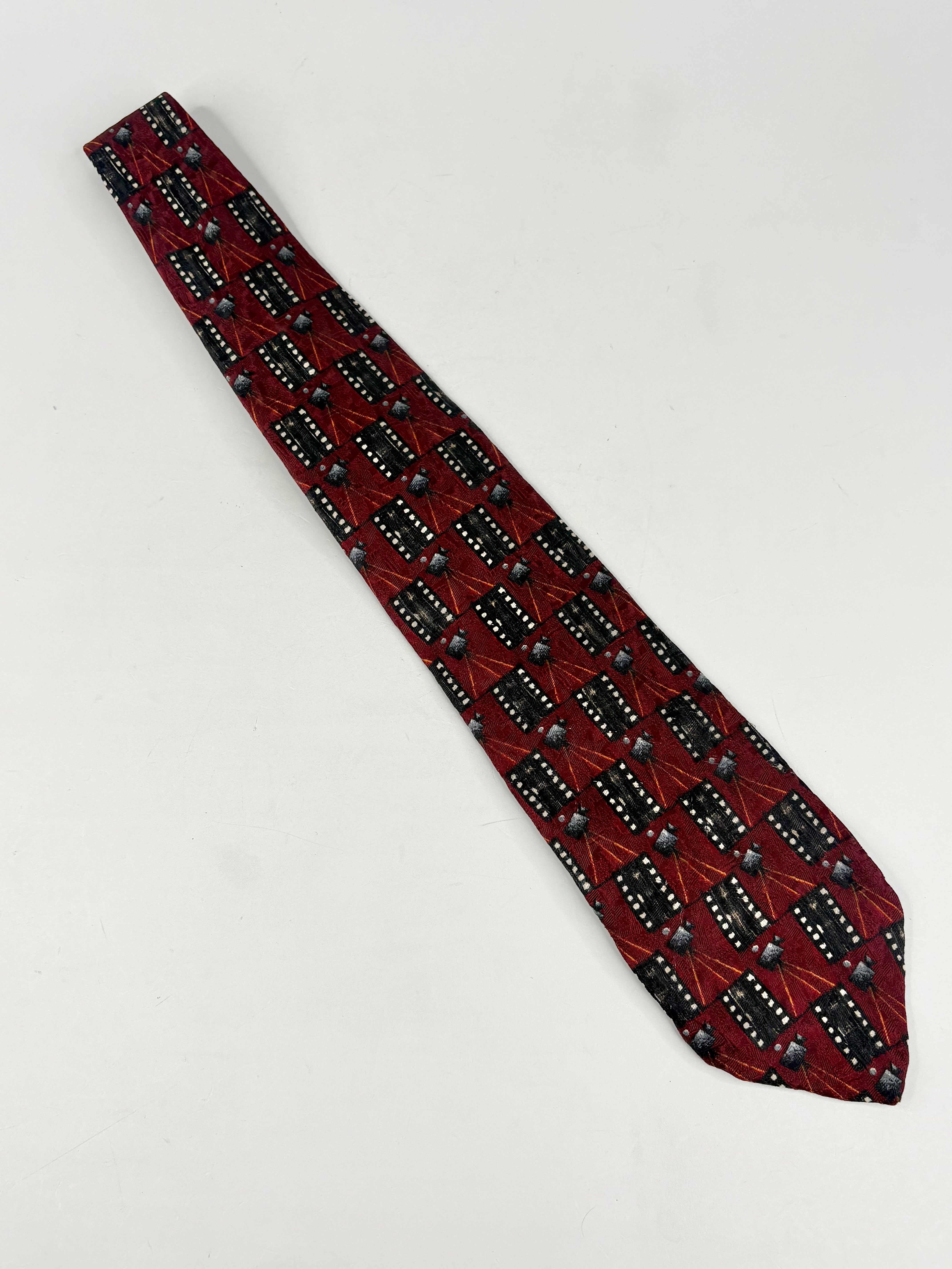 Red patterned tie on a light gray background