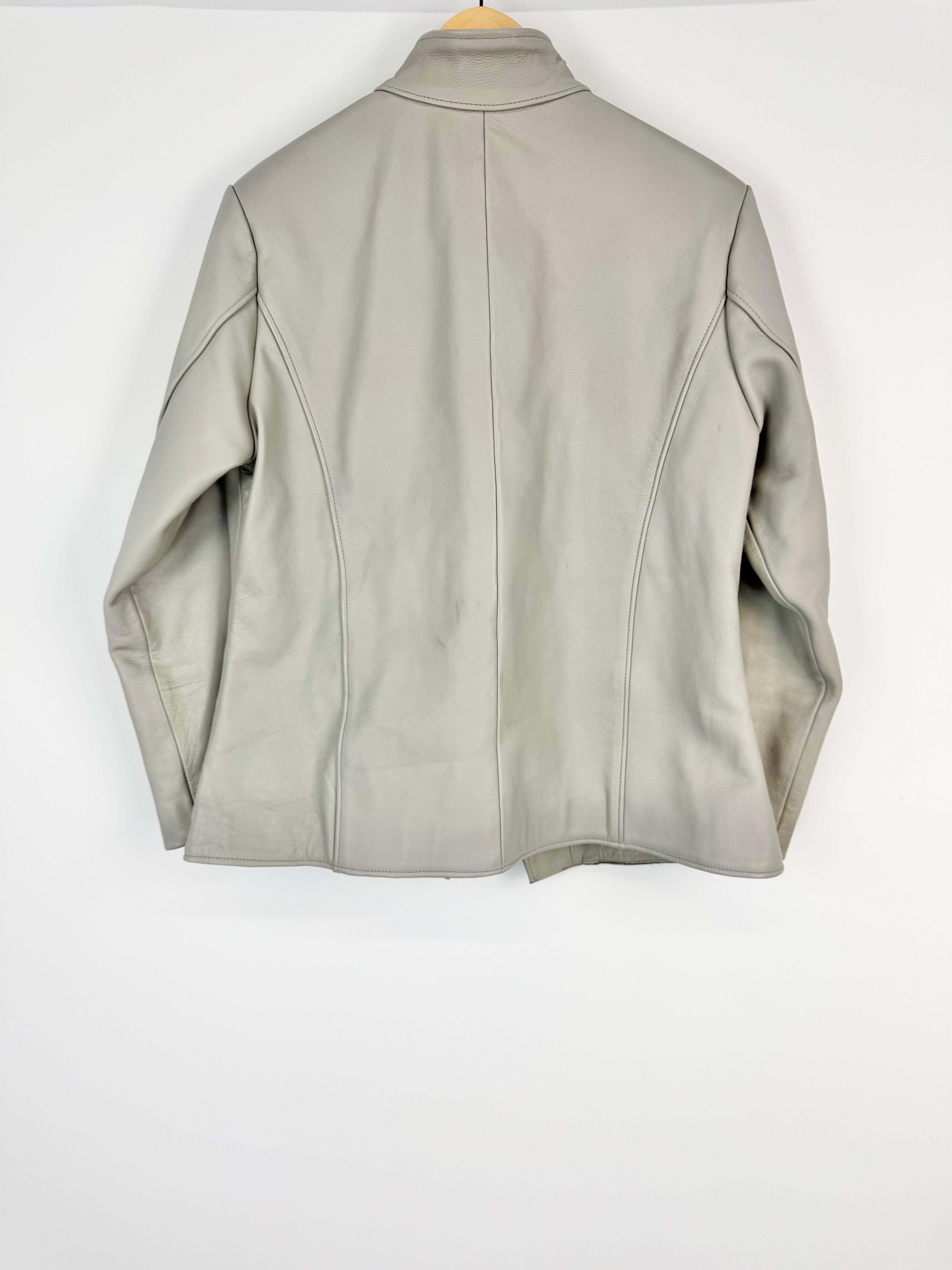 Light gray leather jacket on a white background