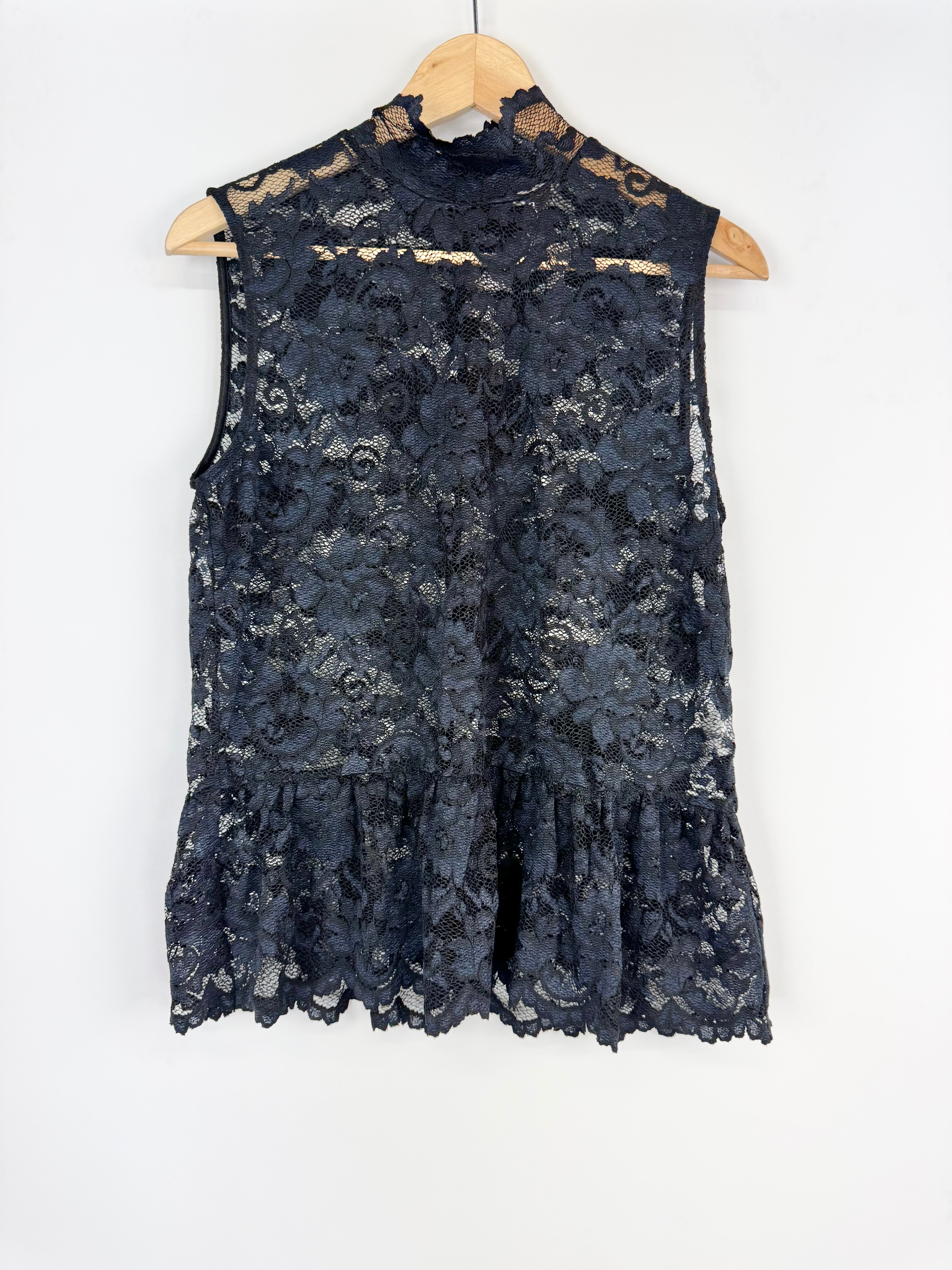 Navy lace sleeveless top on a hanger against a white background