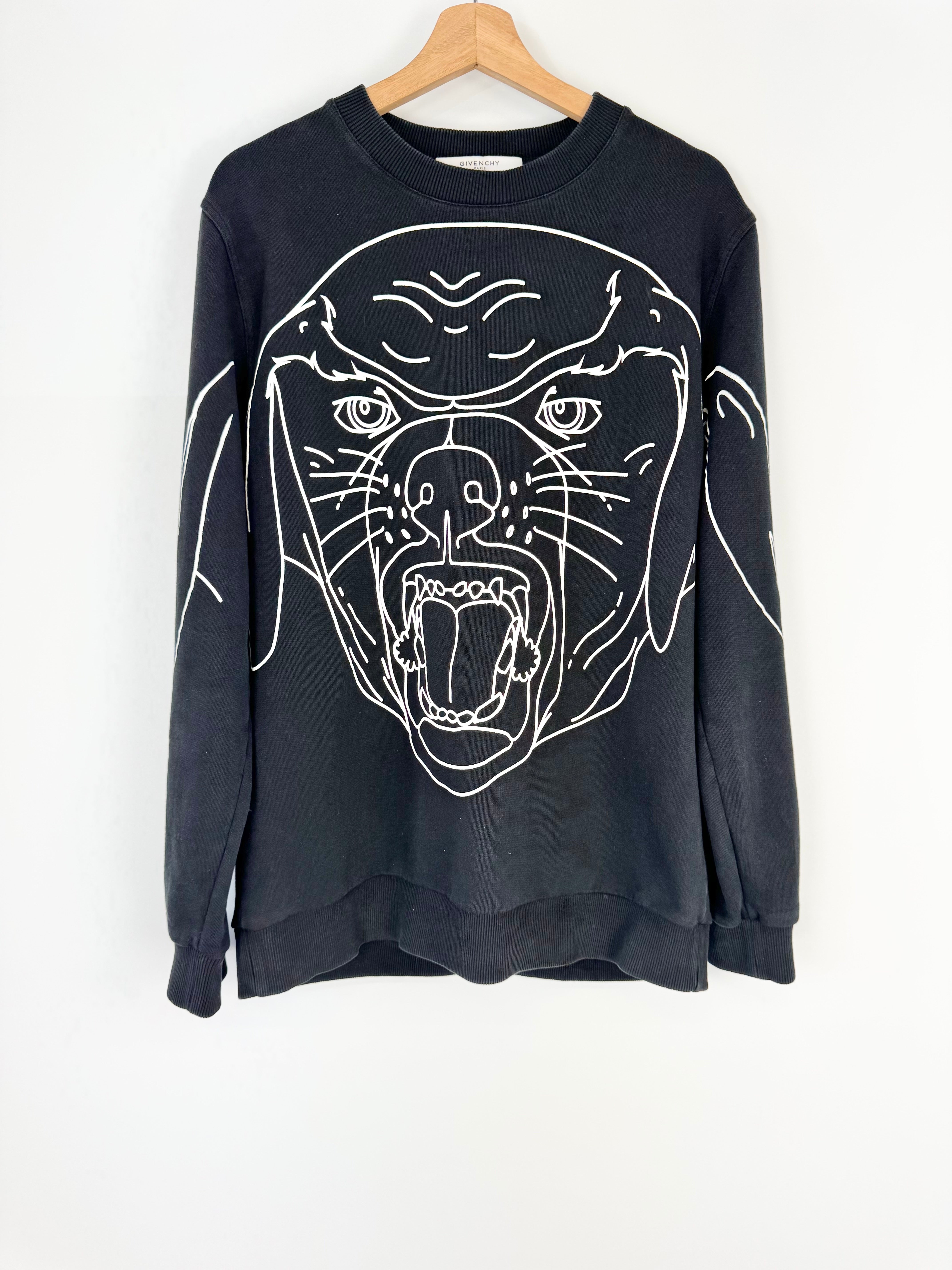 Black sweatshirt with white panther design on a hanger against a white background