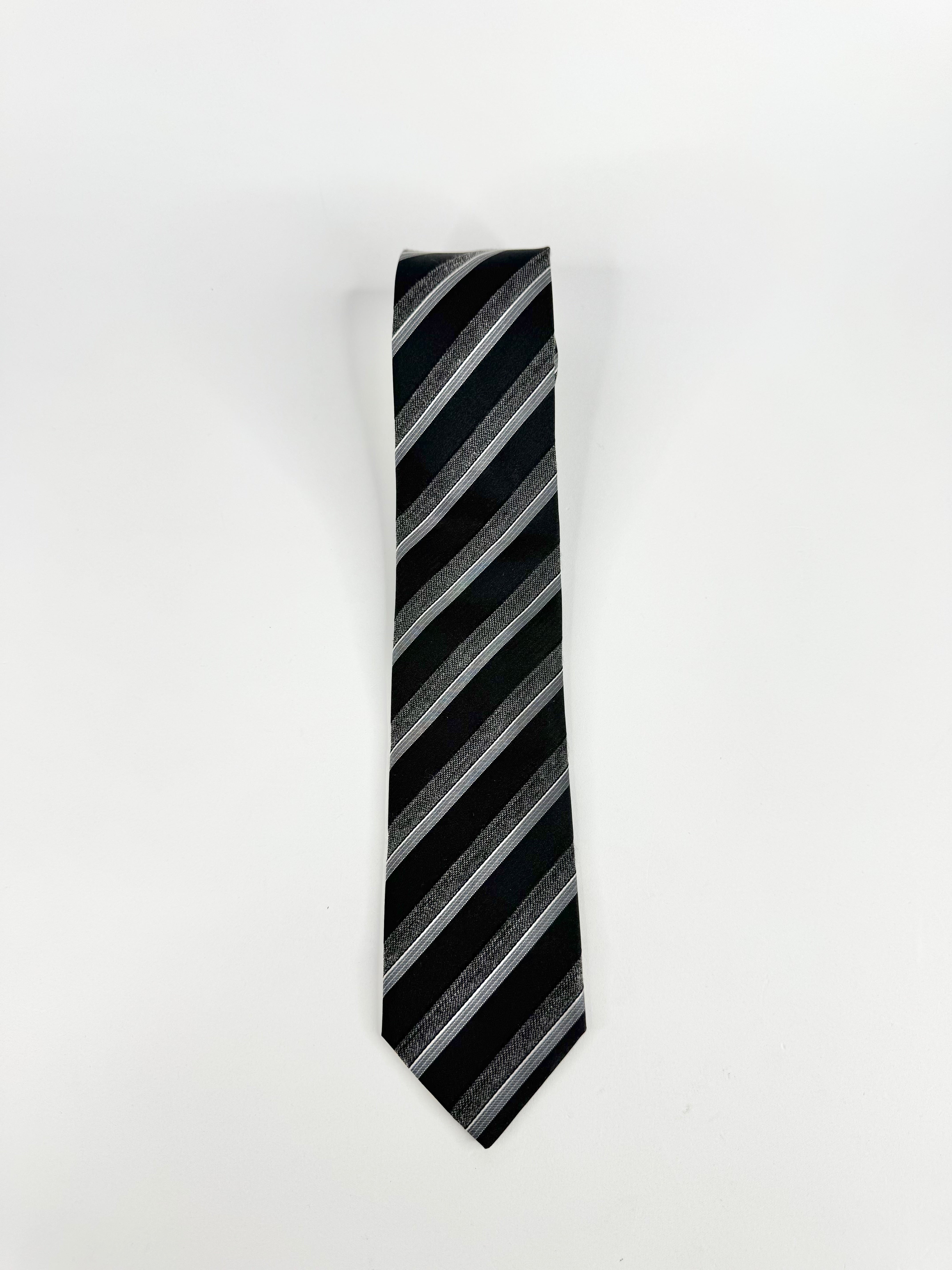 Black and gray striped tie on a white background