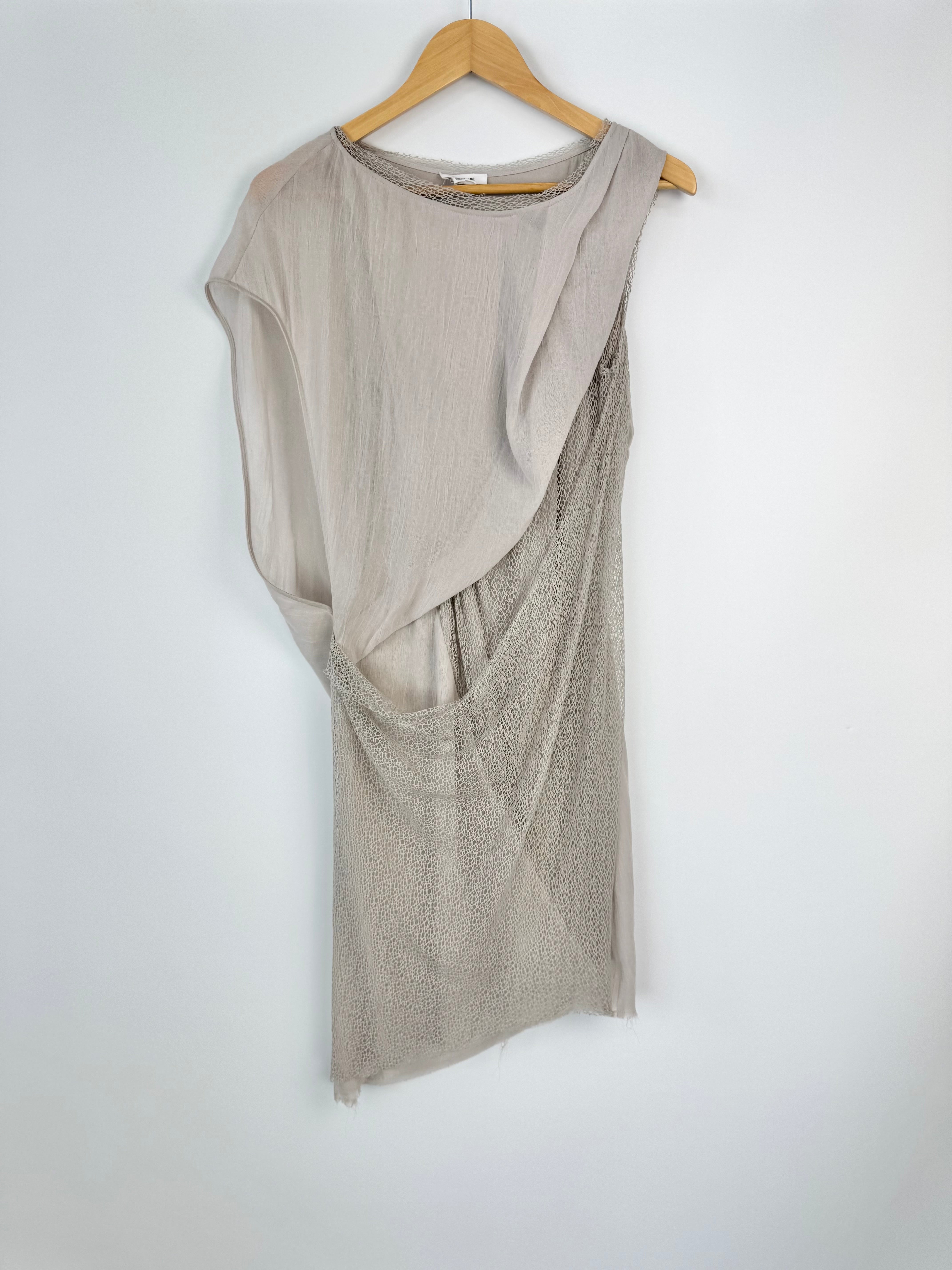 Beige sleeveless dress on a wooden hanger against a white background