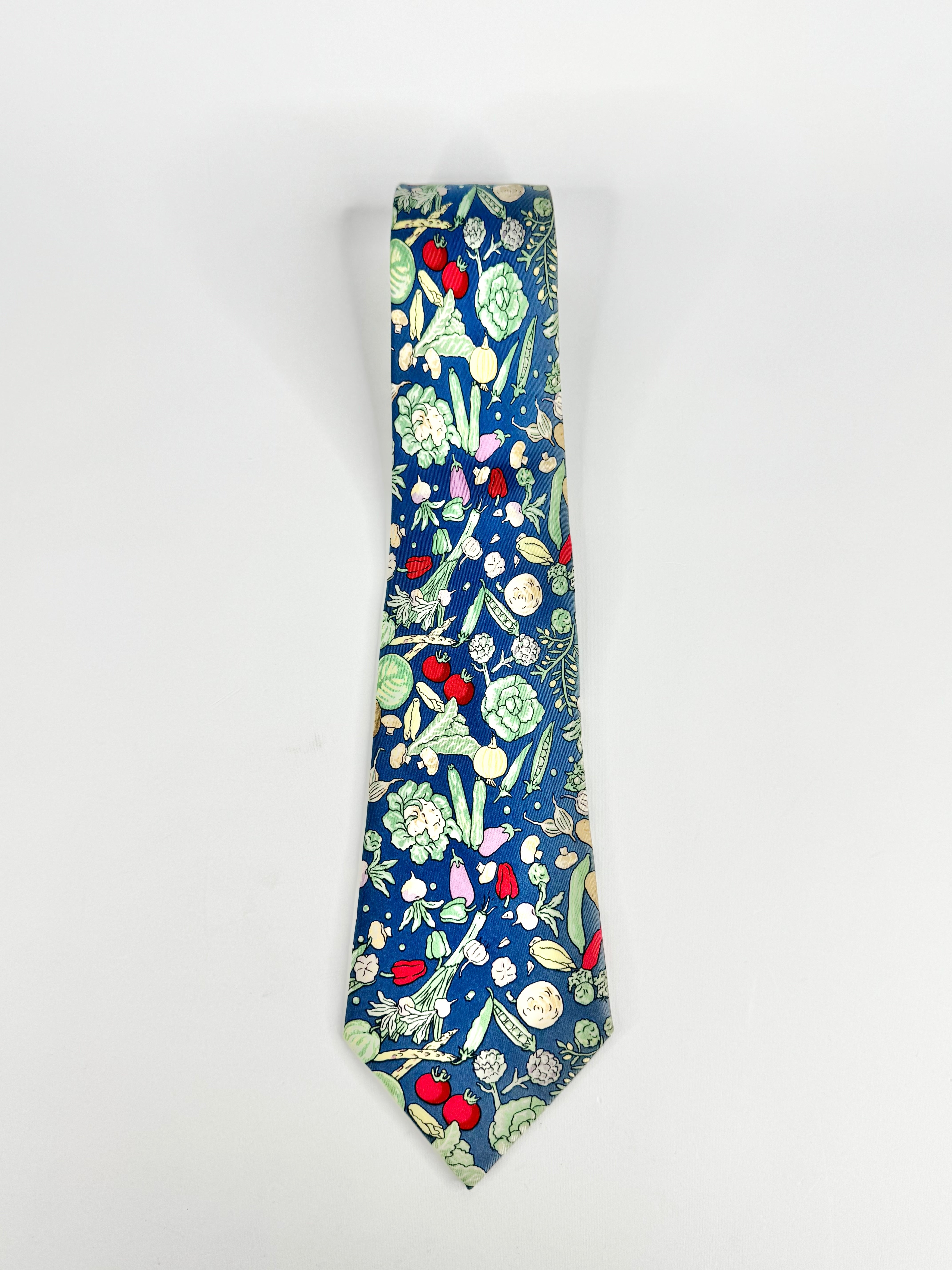 Hermès Blue Silk Vegetable Patterned '7460' Tie on a white background