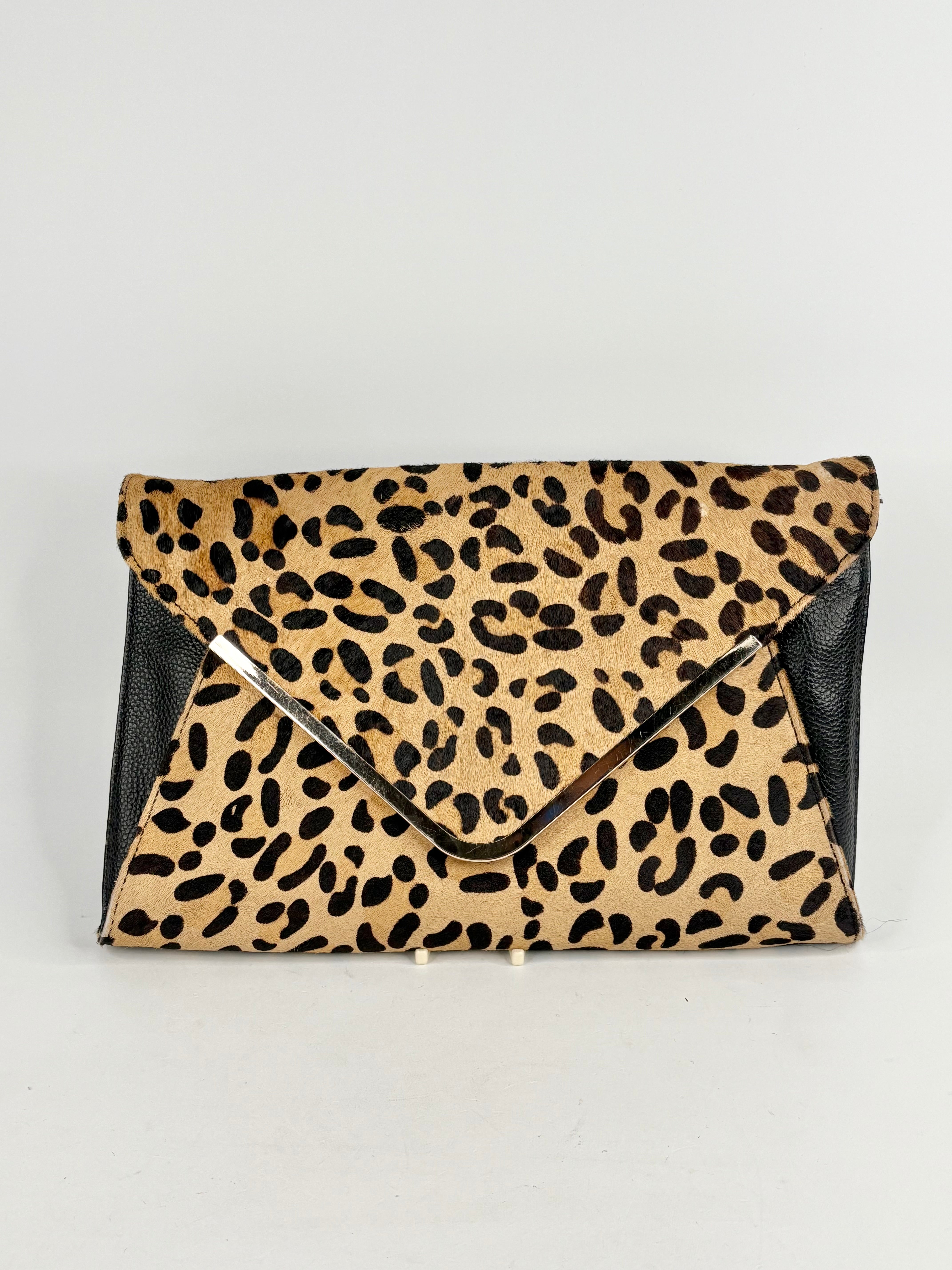Leopard print clutch bag on a light gray background