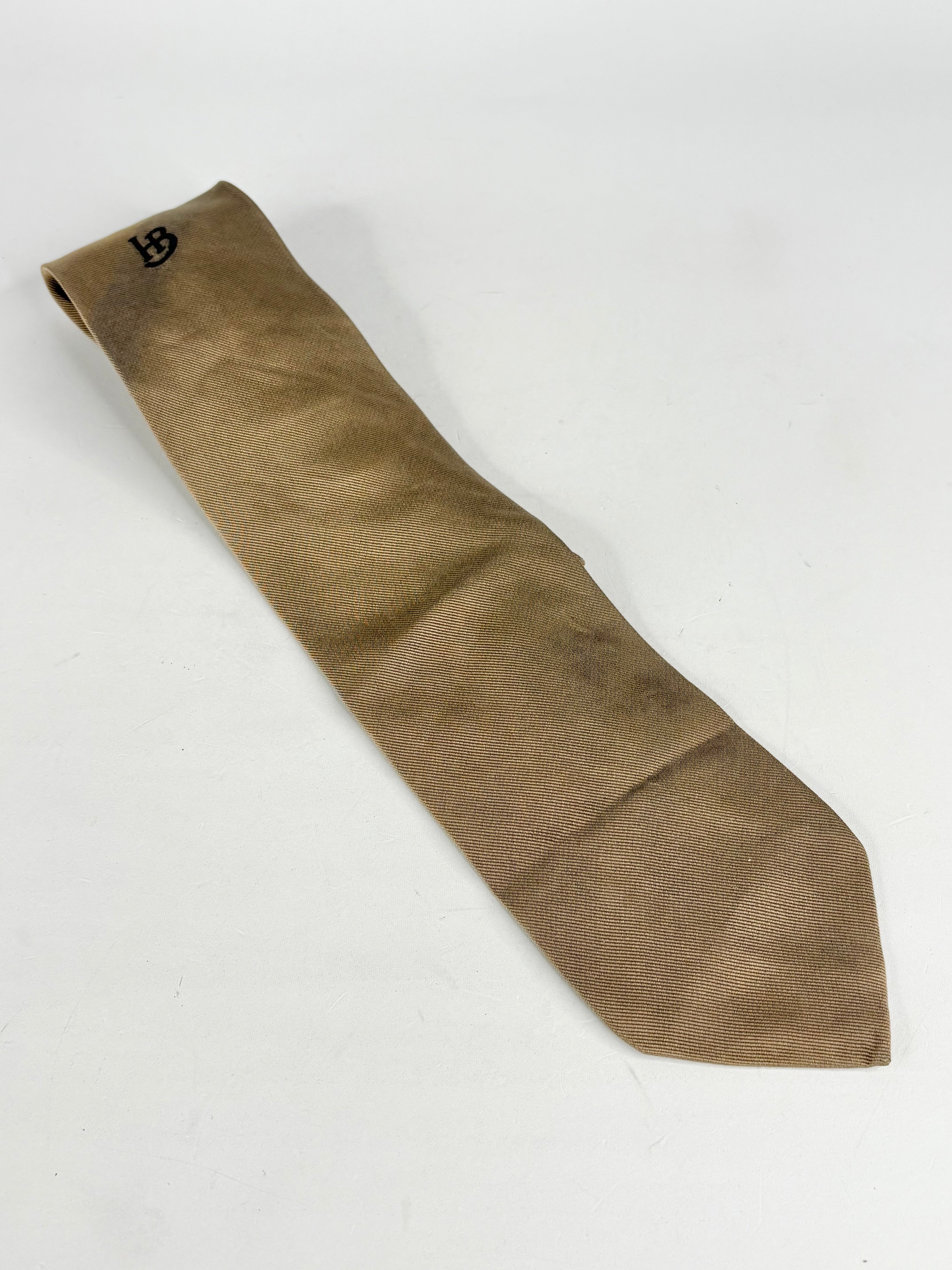 Brown tie with a logo on a white background