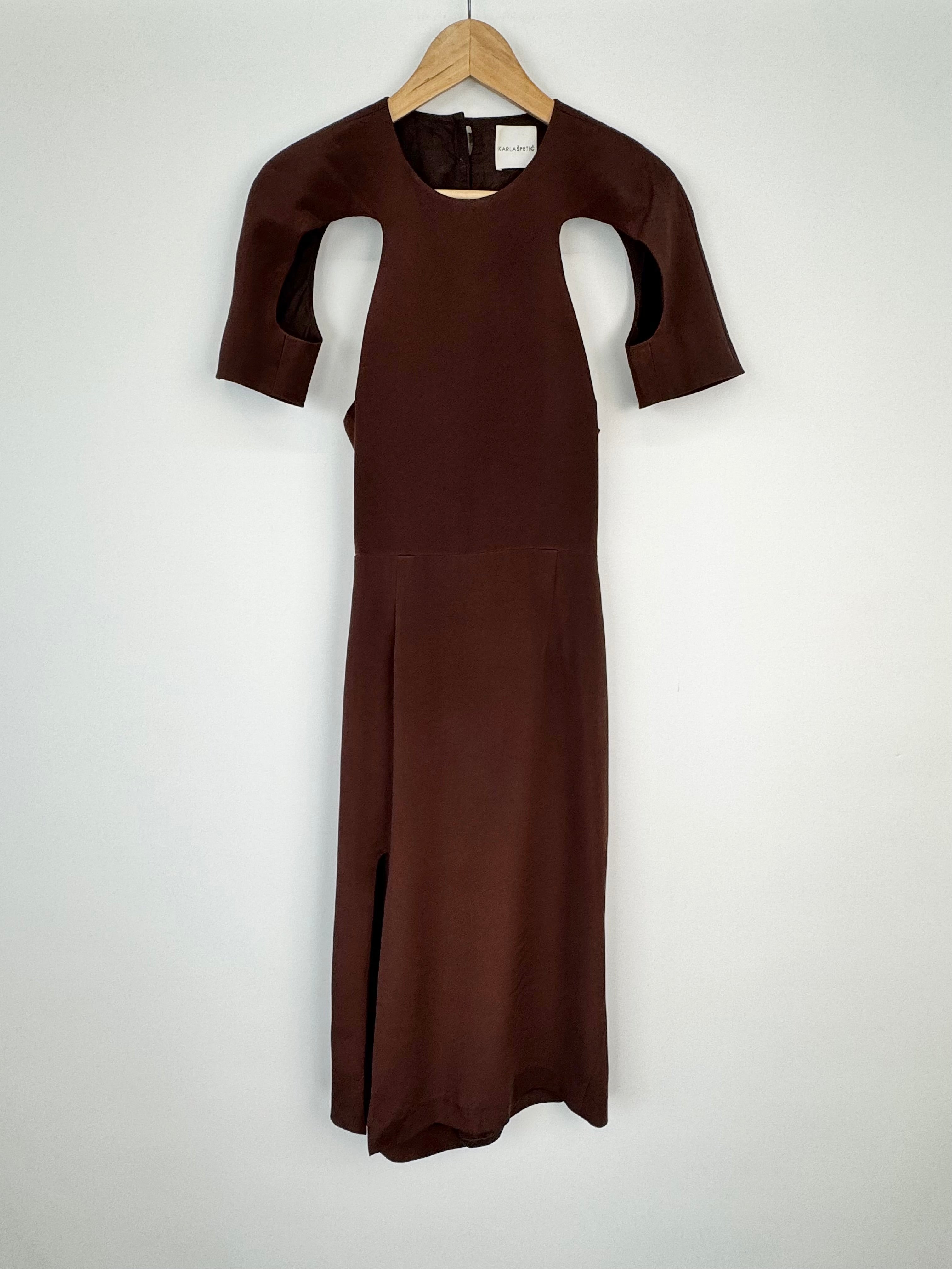Express Brown cut out midi dress on a wooden hanger against a white background