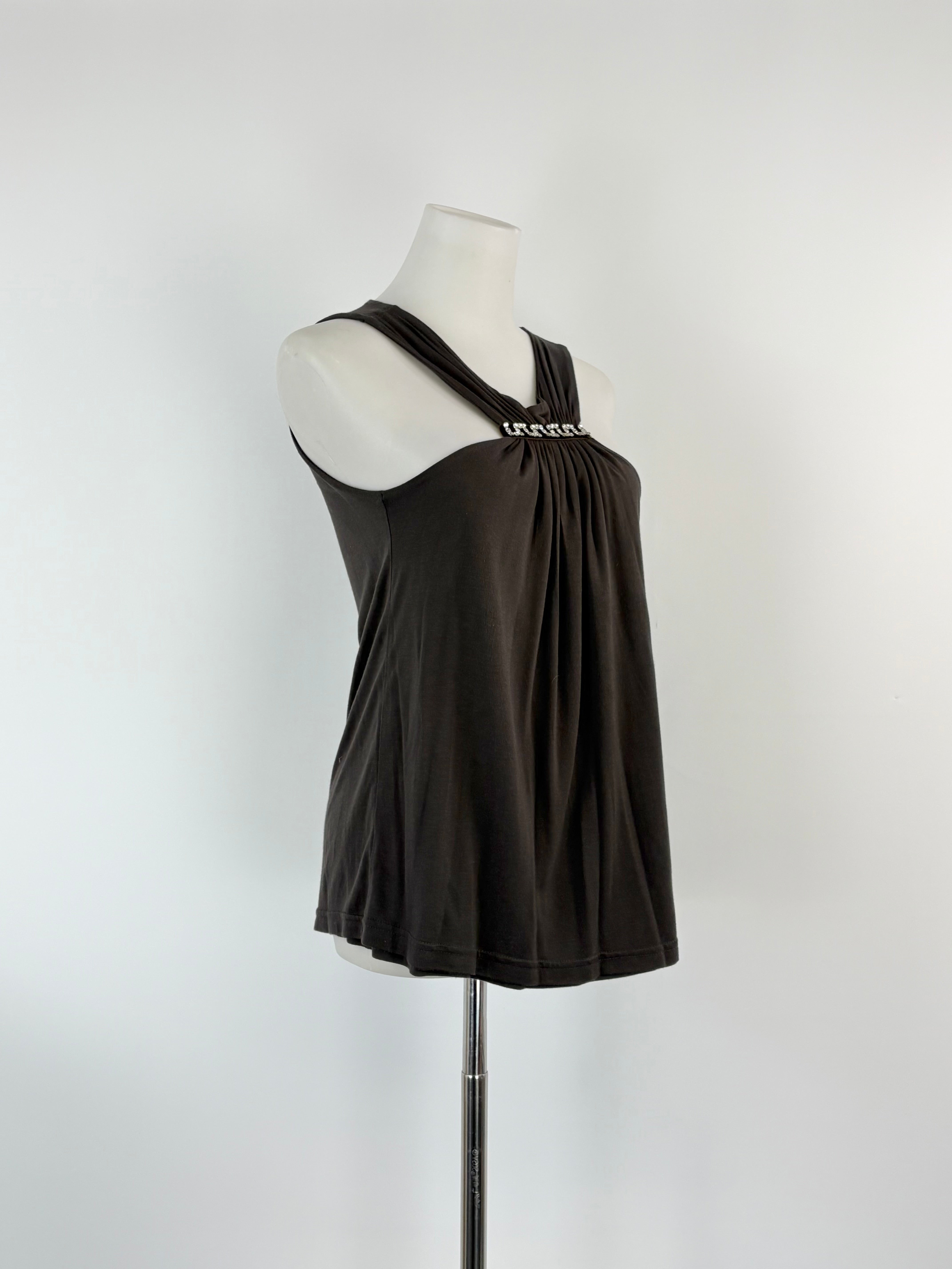 Black tank top on a mannequin against a white background