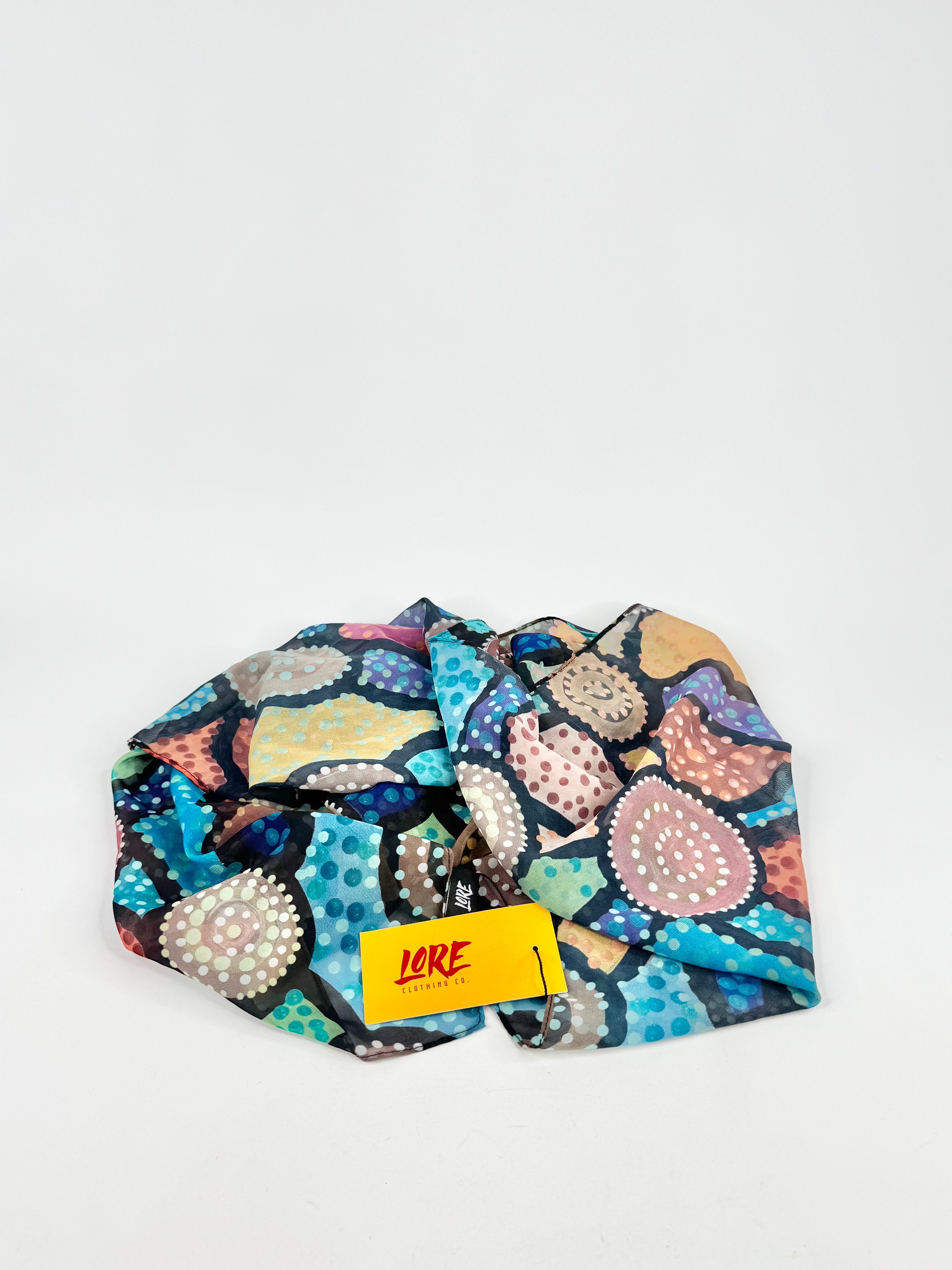 Colorful patterned fabric with a yellow label on a white background