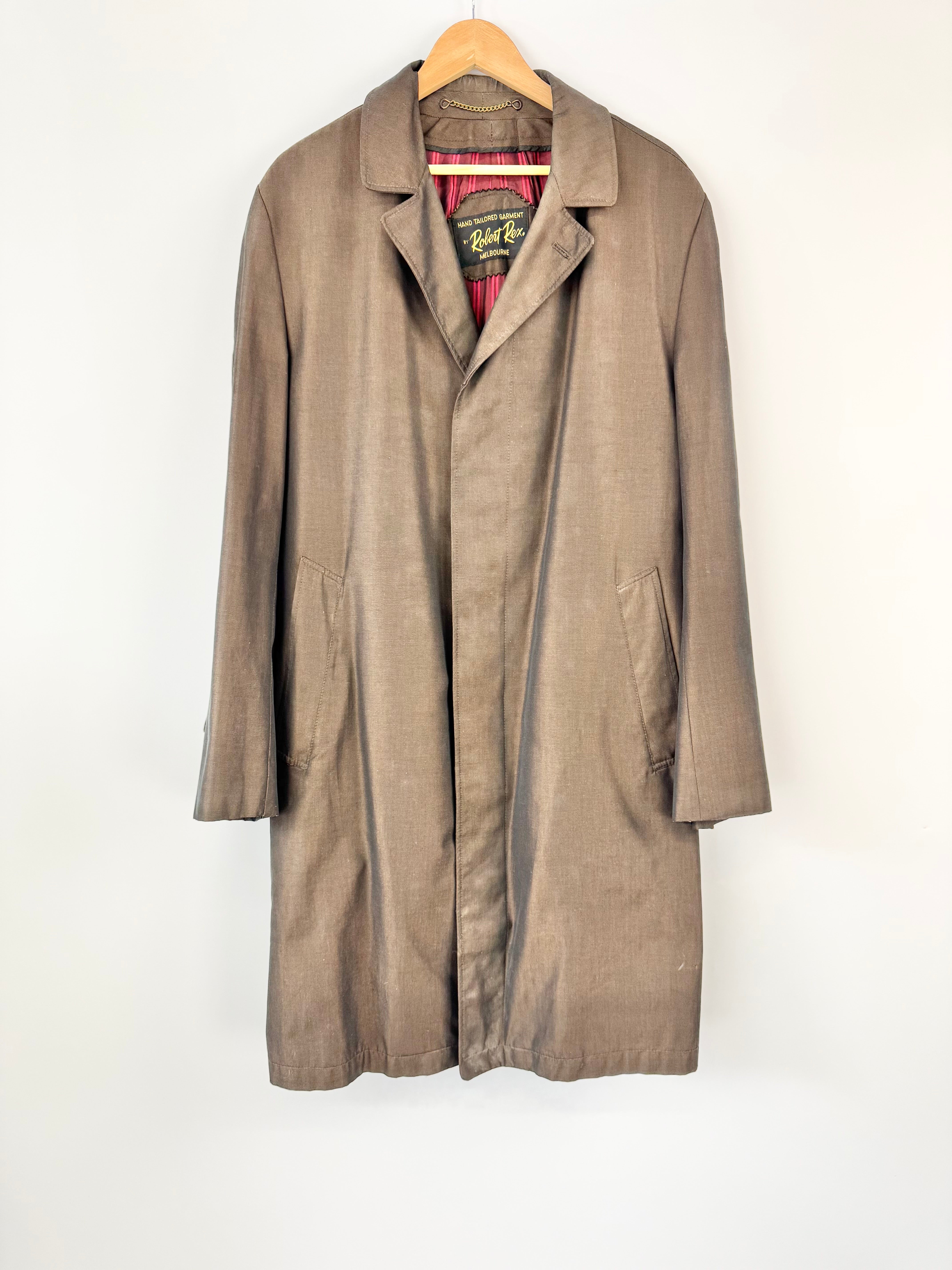 Brown coat on a hanger against a white background
