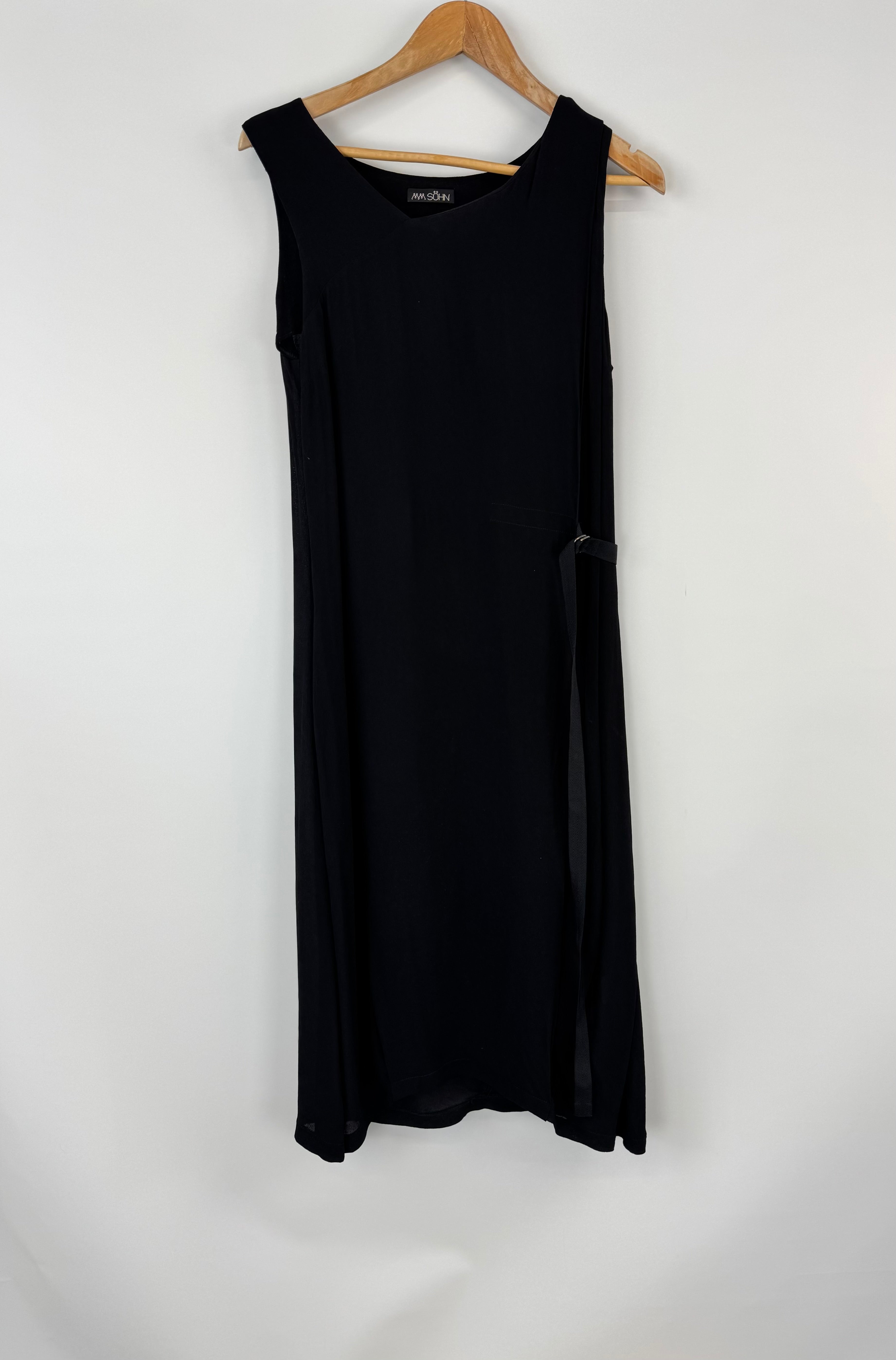 Black sleeveless dress on a hanger against a white background