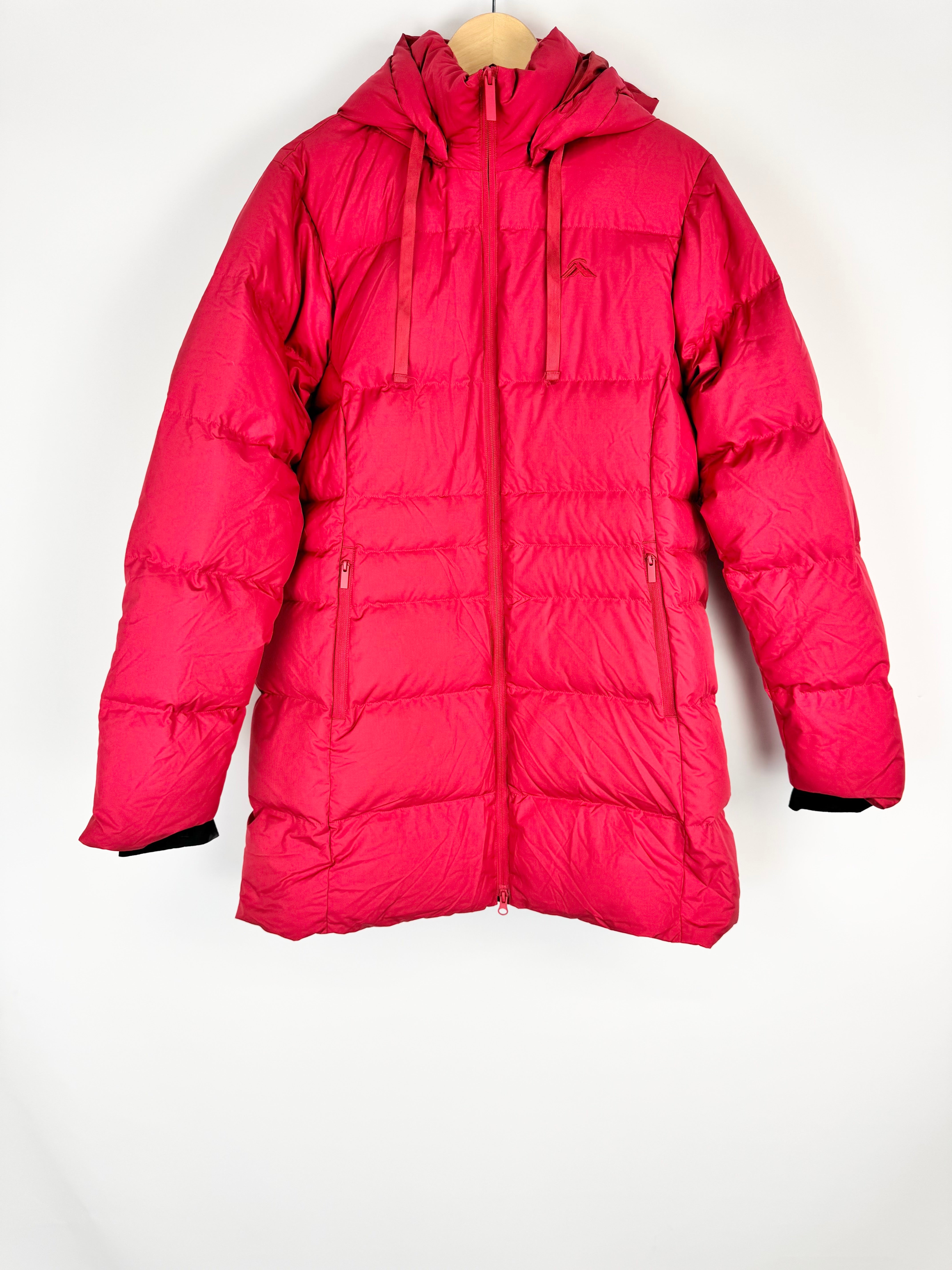 Red puffer jacket on a mannequin against a white background