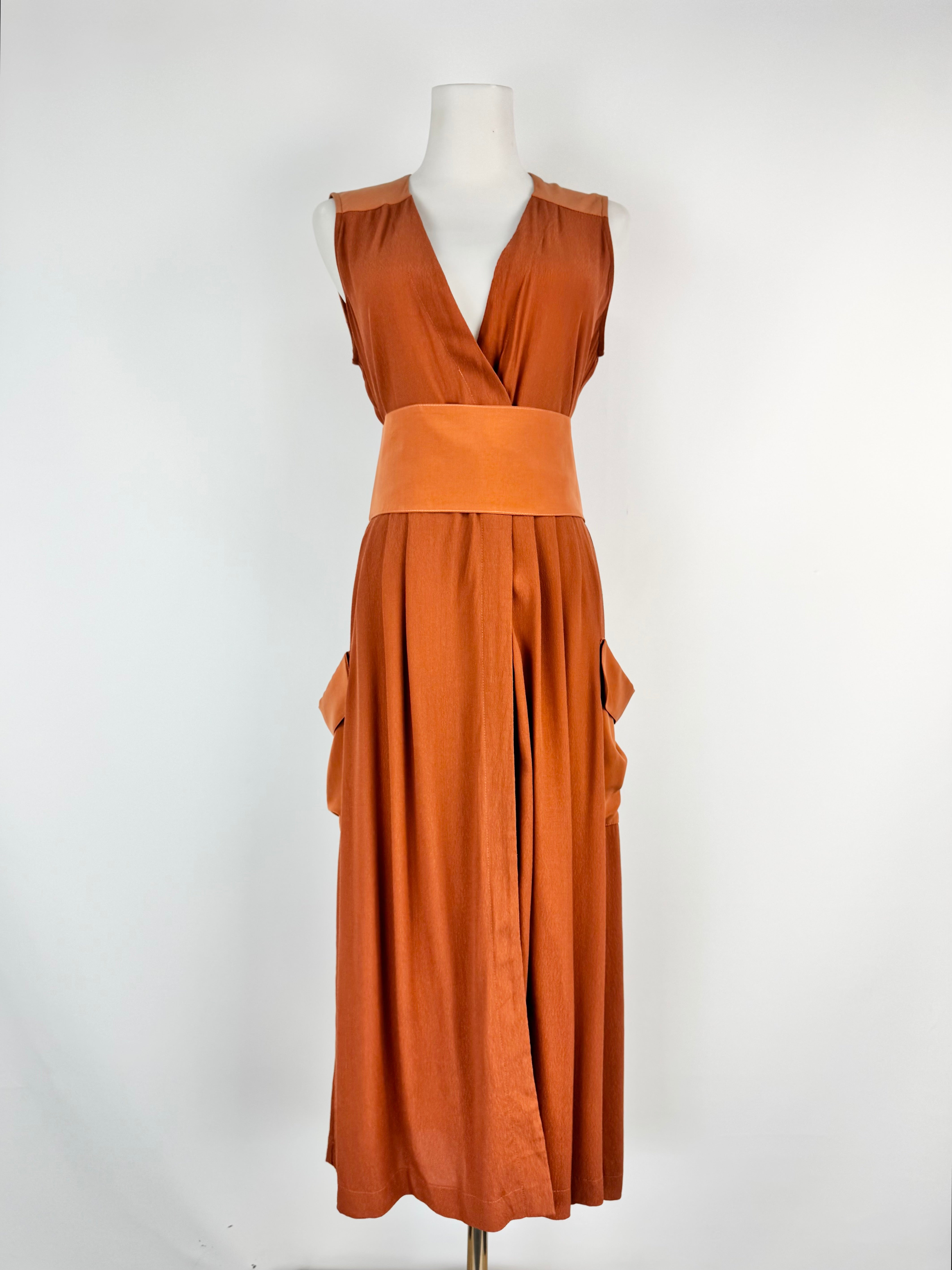 Brown dress on a mannequin against a white background