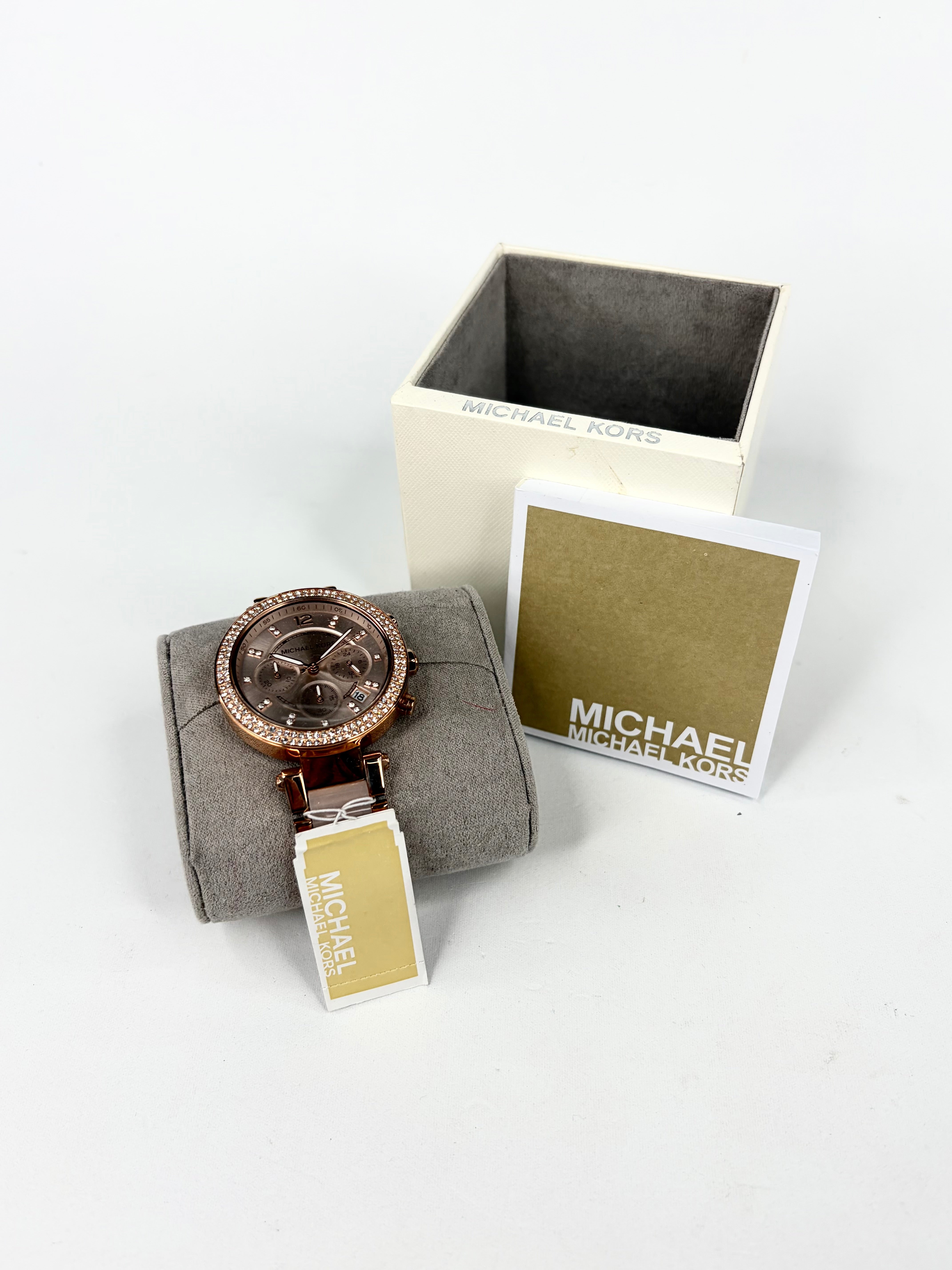 Michael Kors watch with box on a white background