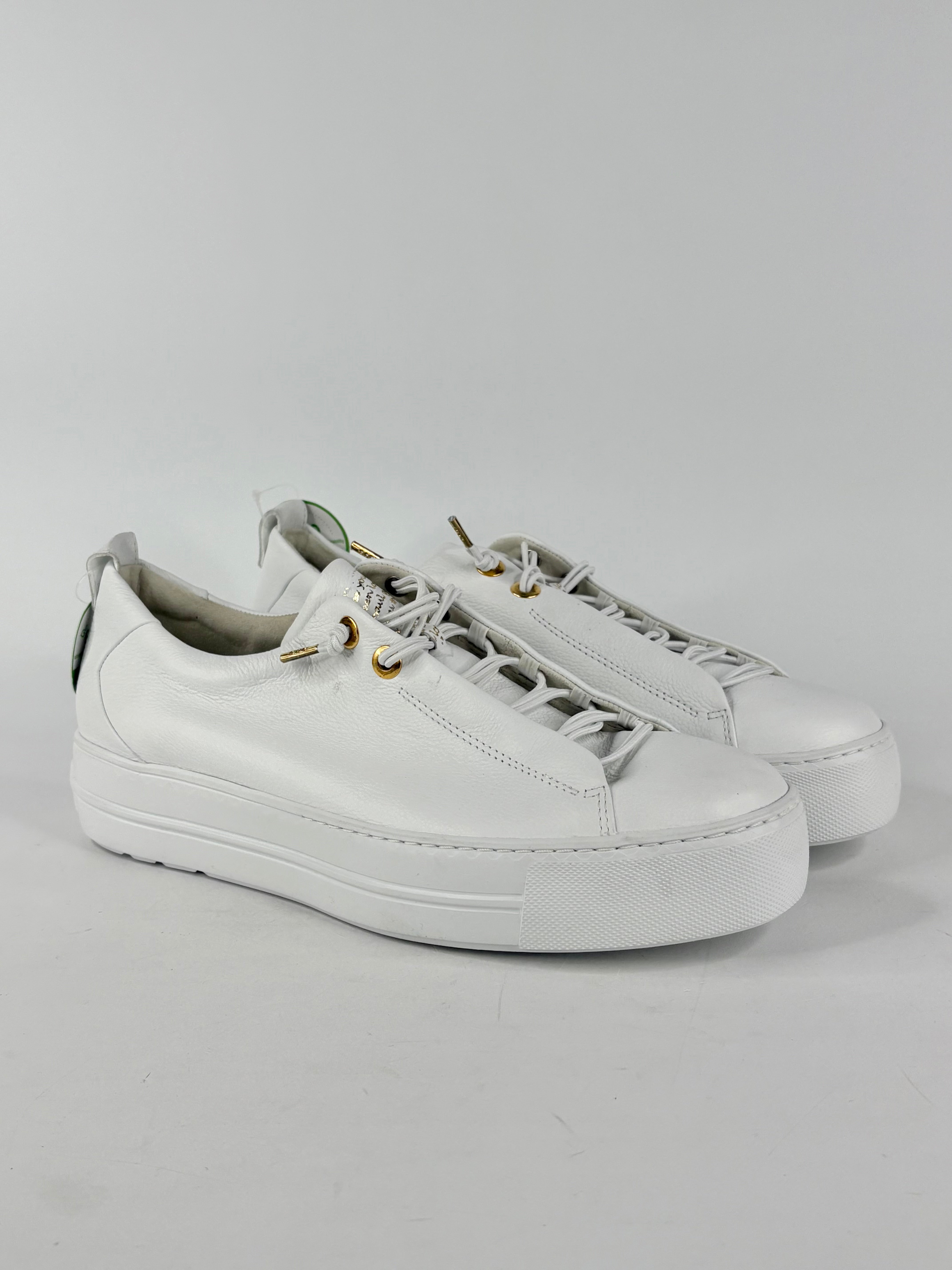White sneakers on a light gray background