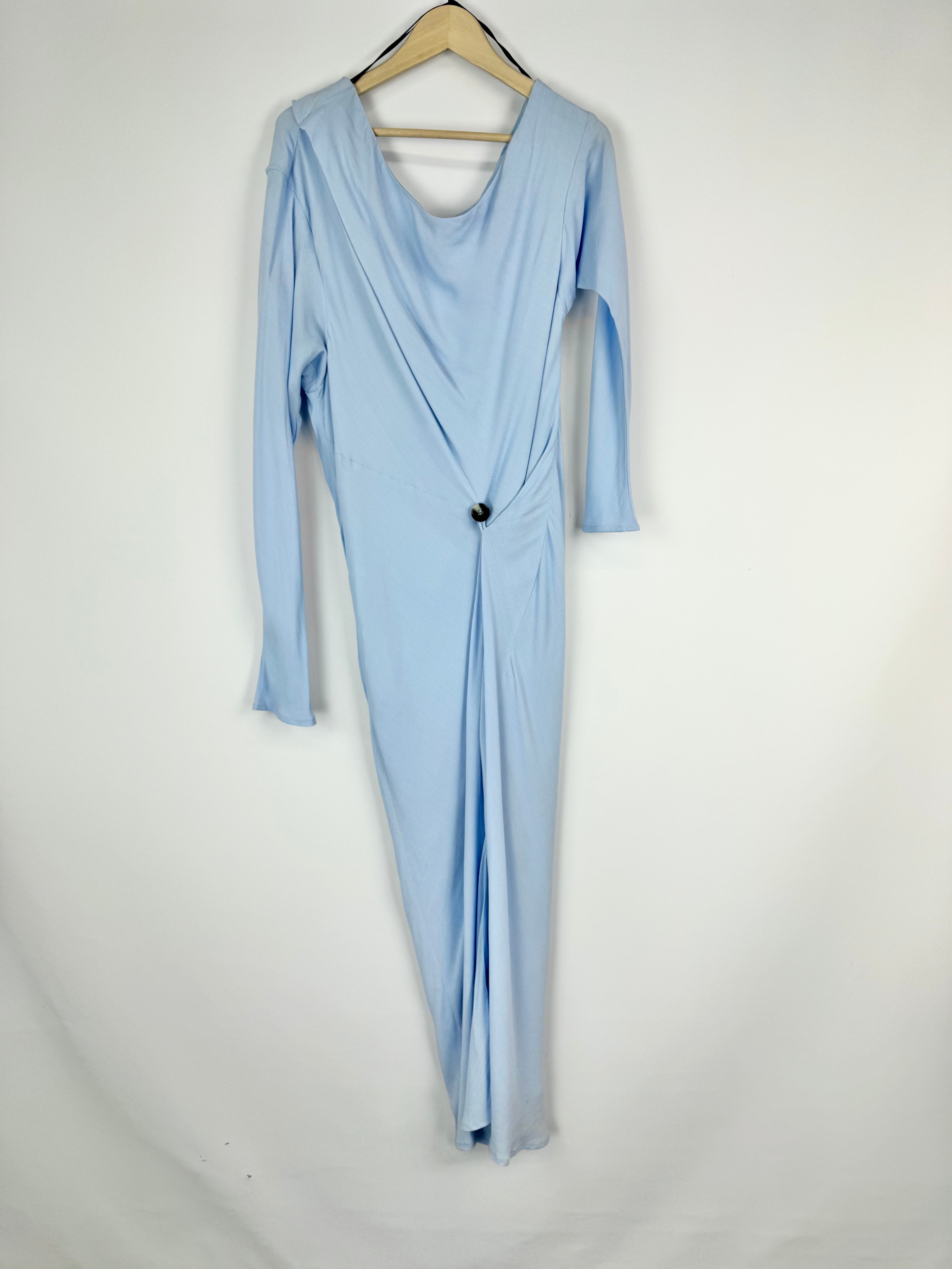 Light blue dress on a hanger against a white background