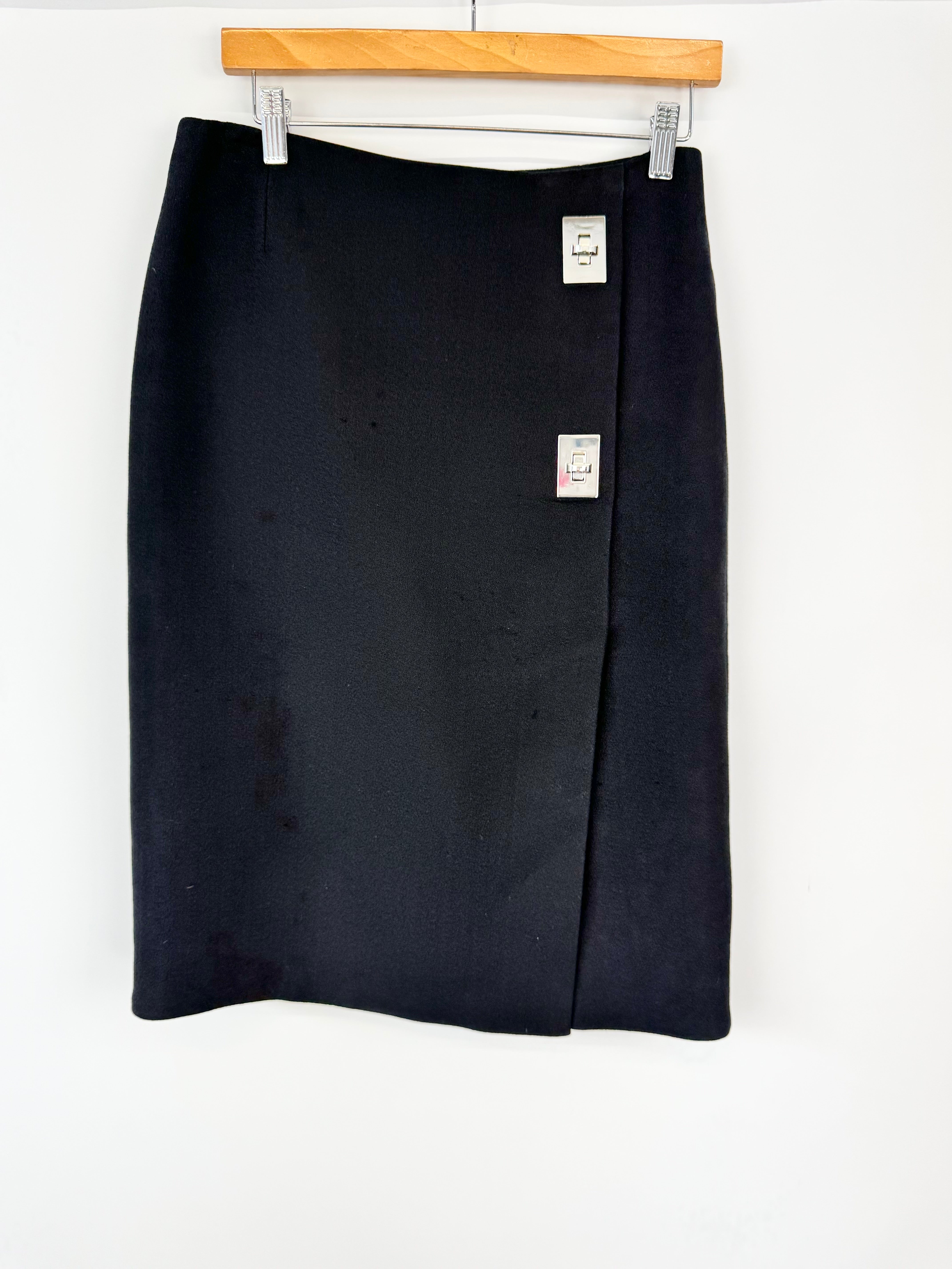 Black skirt with tags on a white background