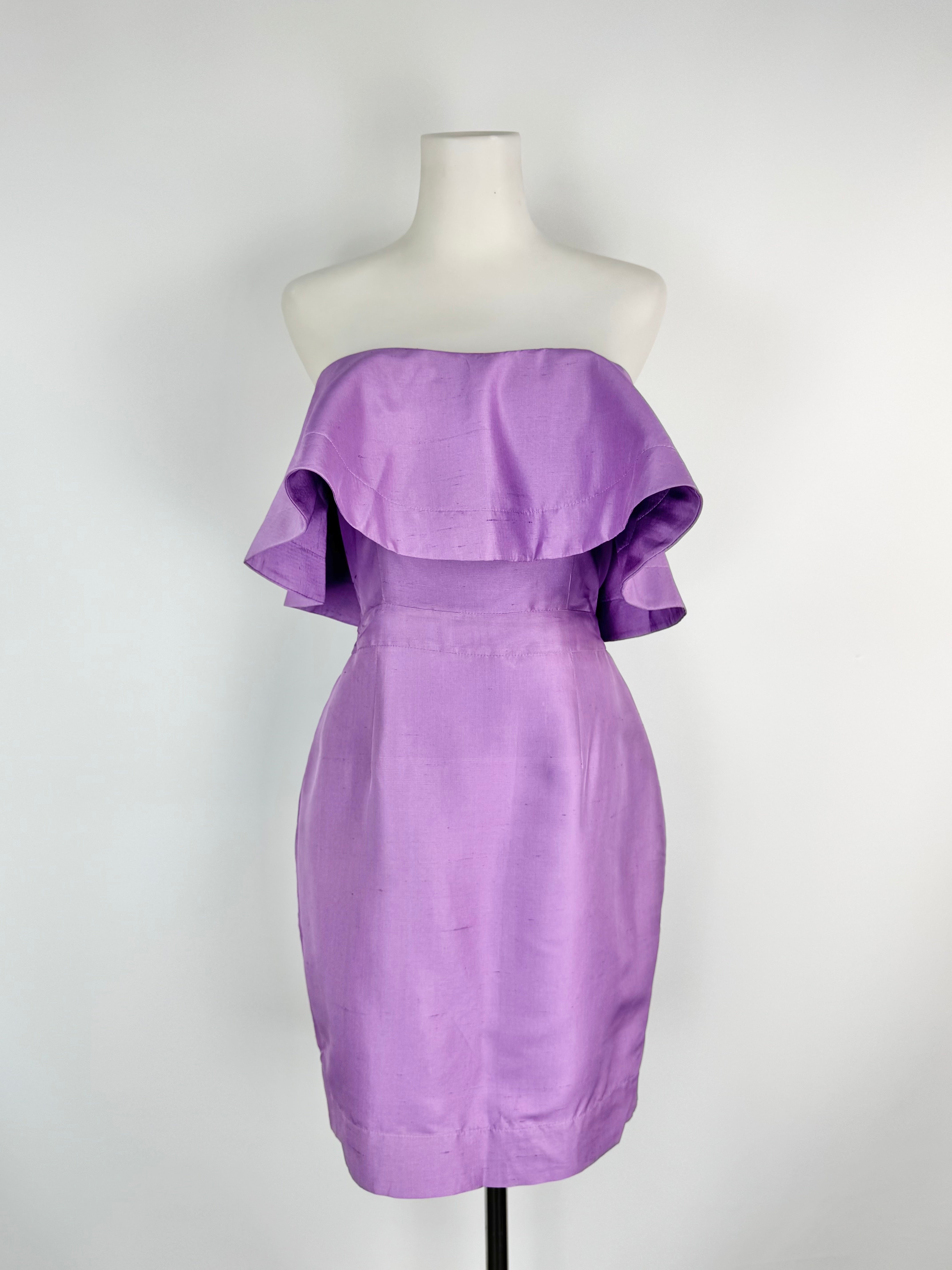 Purple strapless dress on a mannequin against a white background