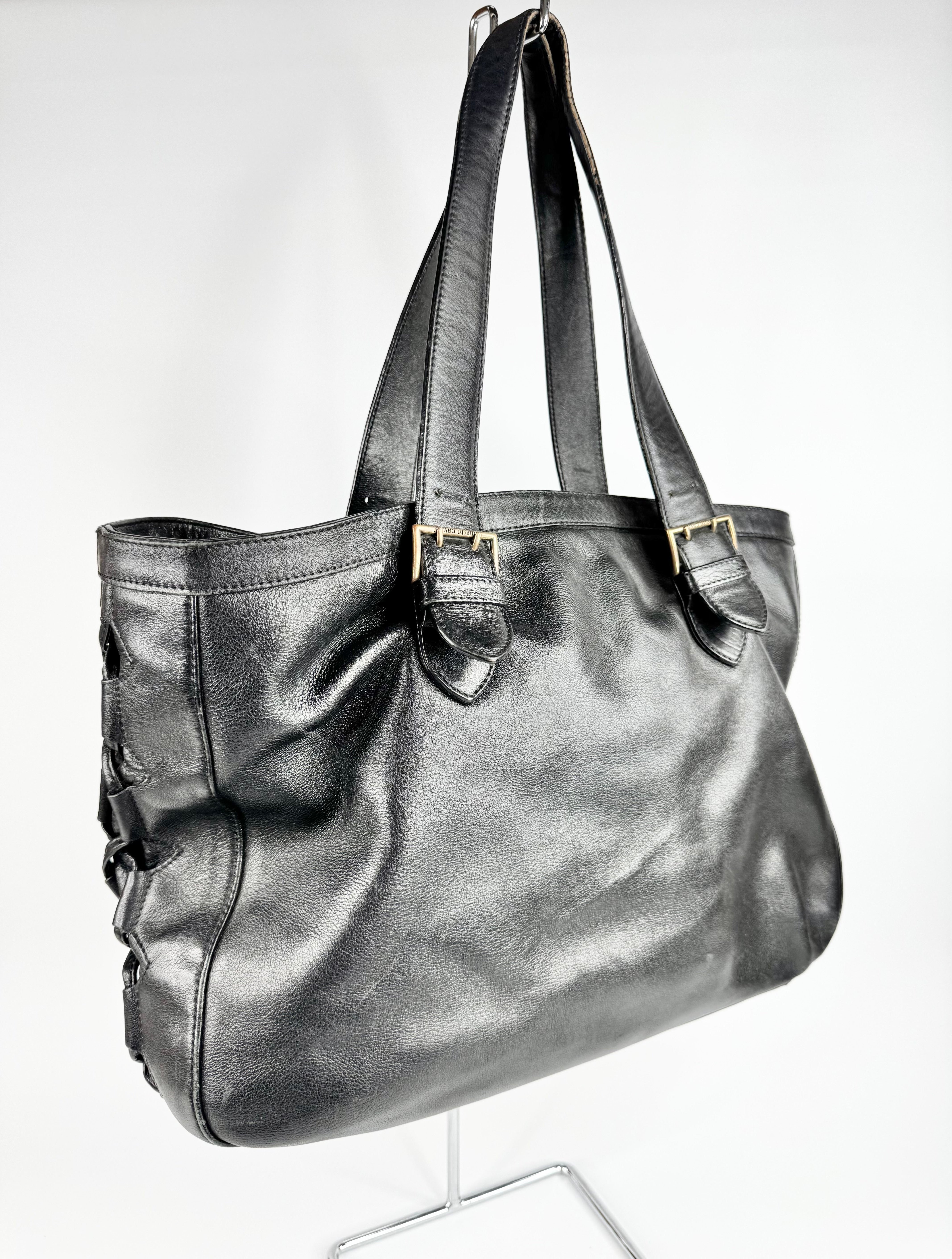 Black leather handbag on a white background