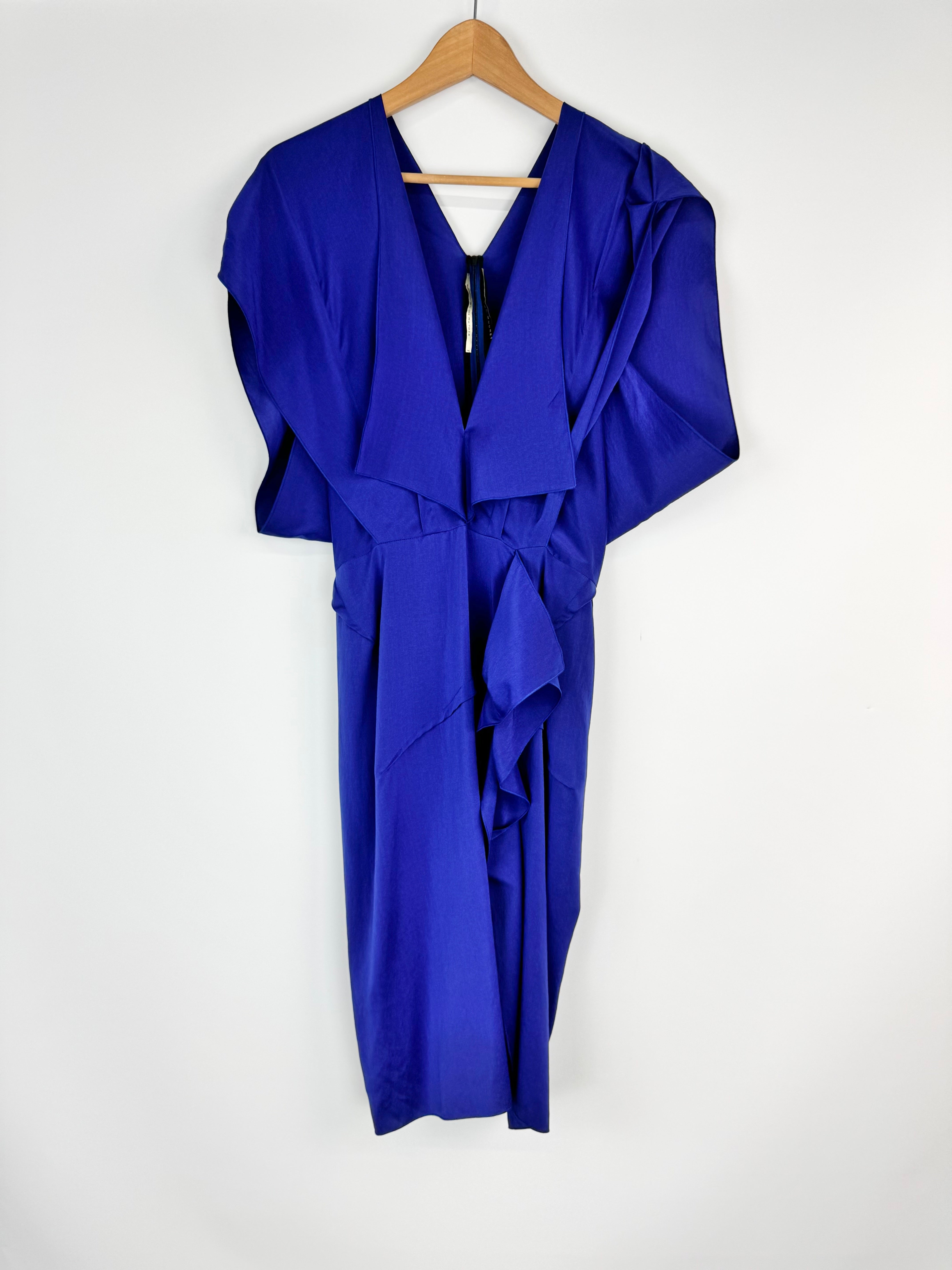 Blue dress on a hanger against a white background