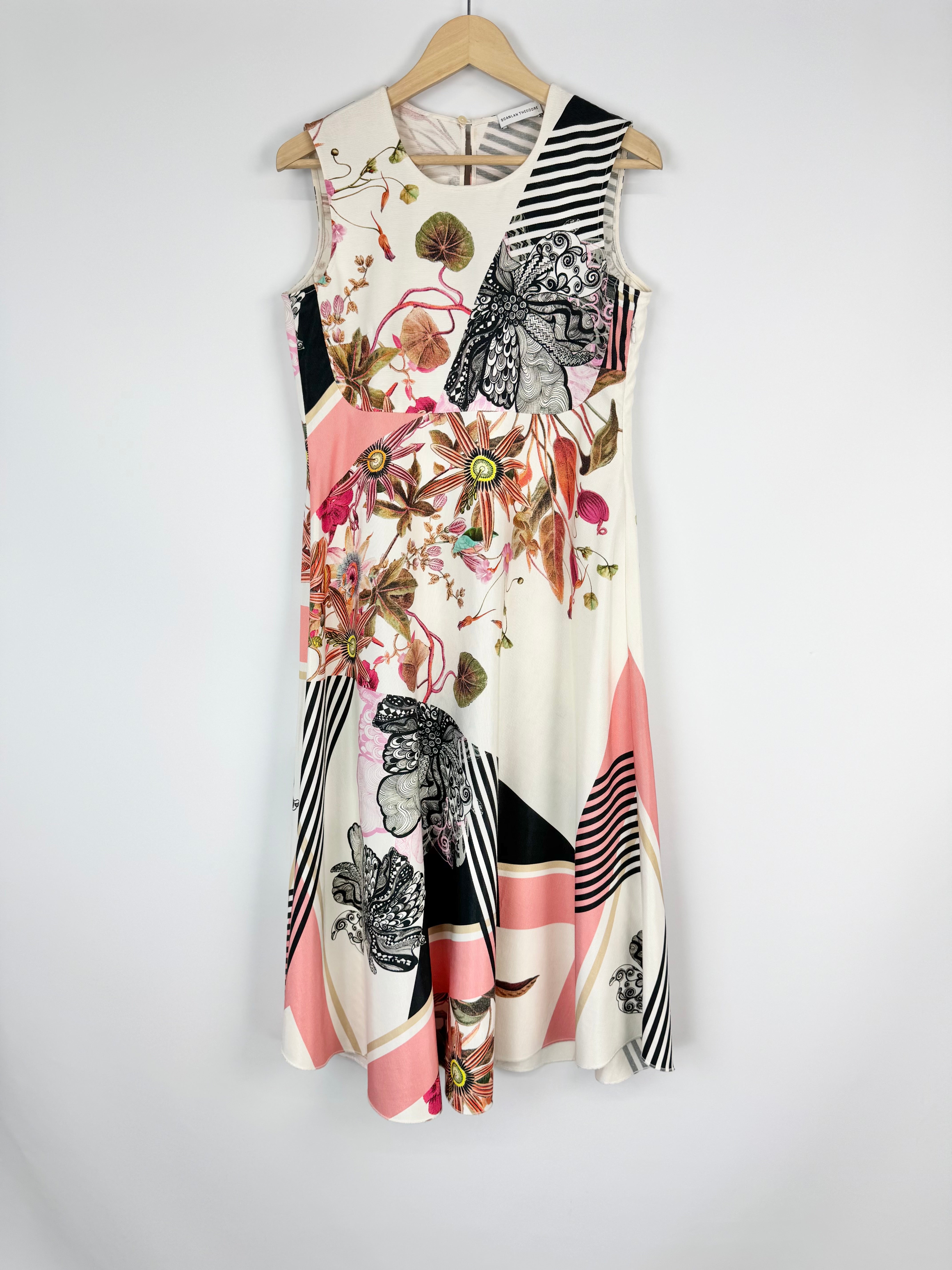 Colorful sleeveless dress with floral and abstract patterns on a white background