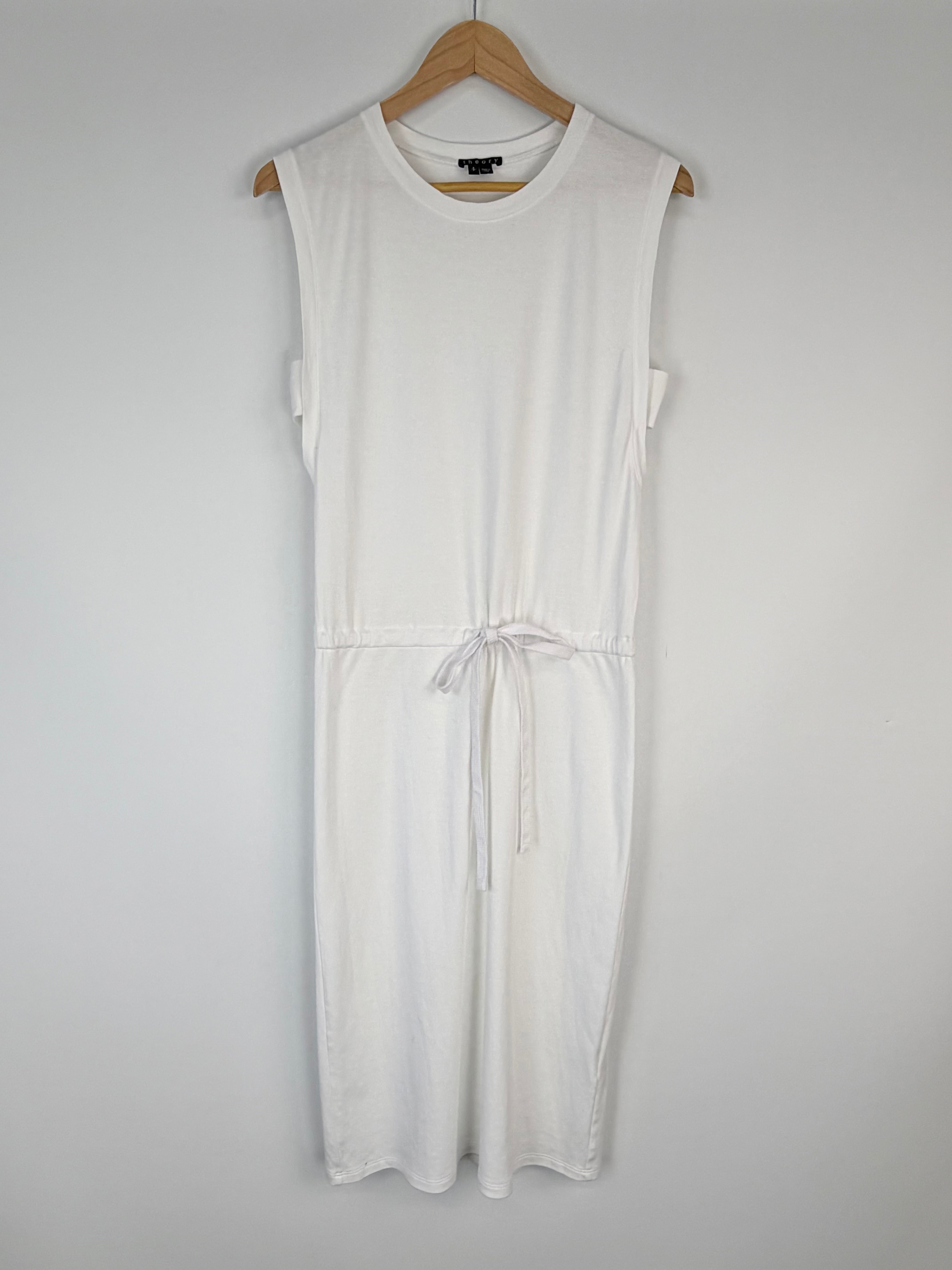 White sleeveless dress on a hanger against a white background