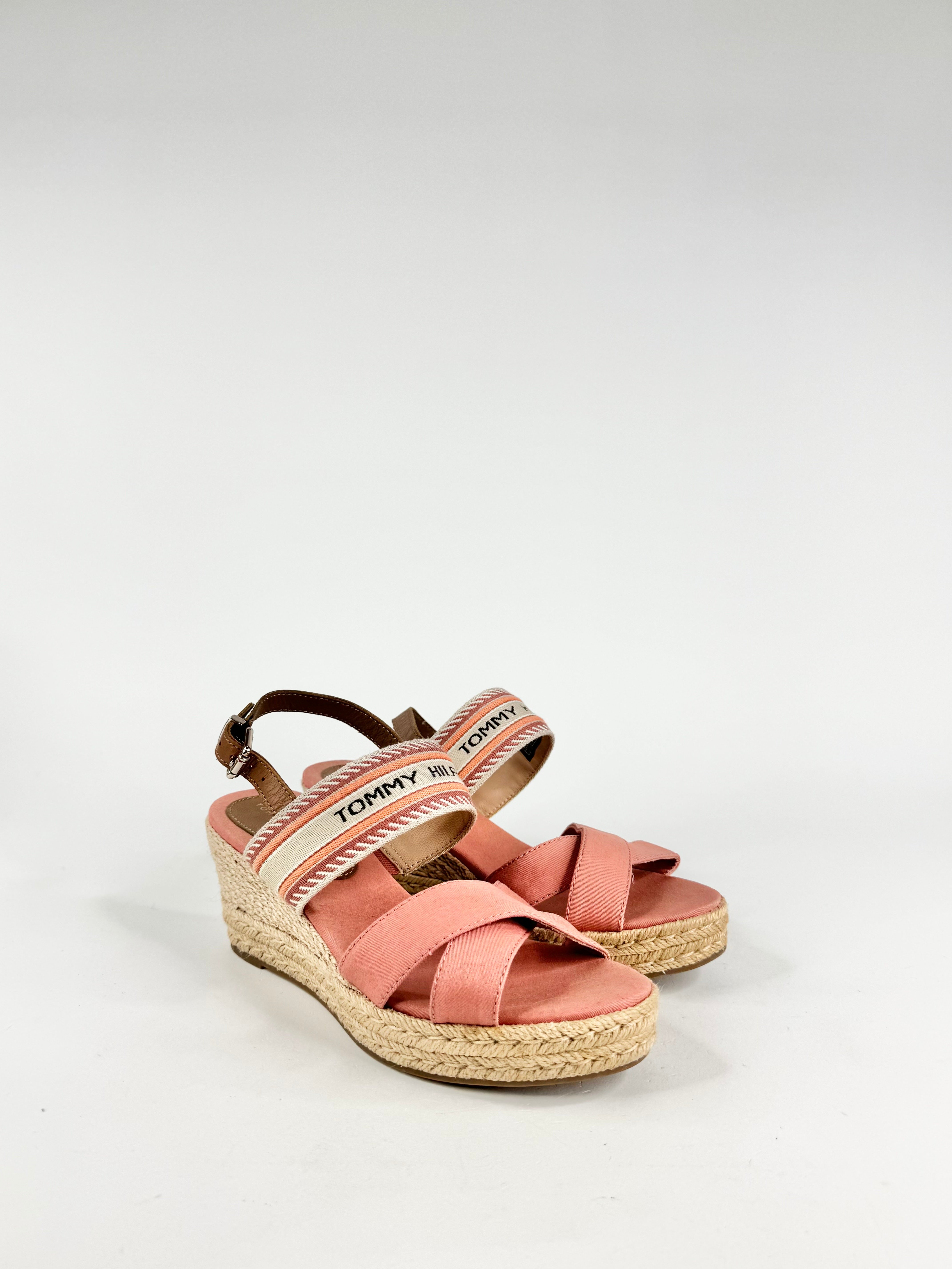 Pink sandal with espadrille sole on a light grey background