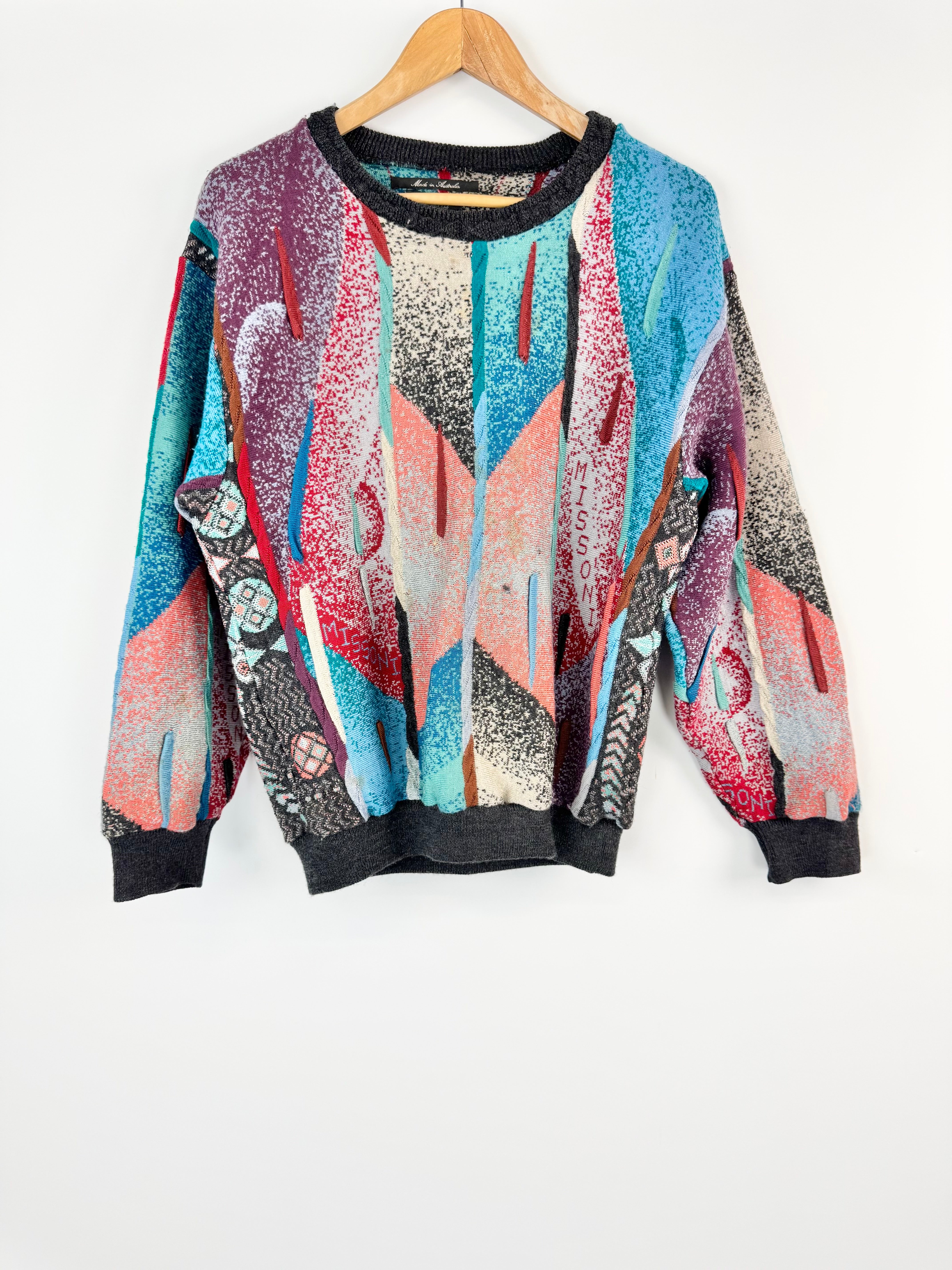 Colorful sweater with abstract design on a white background