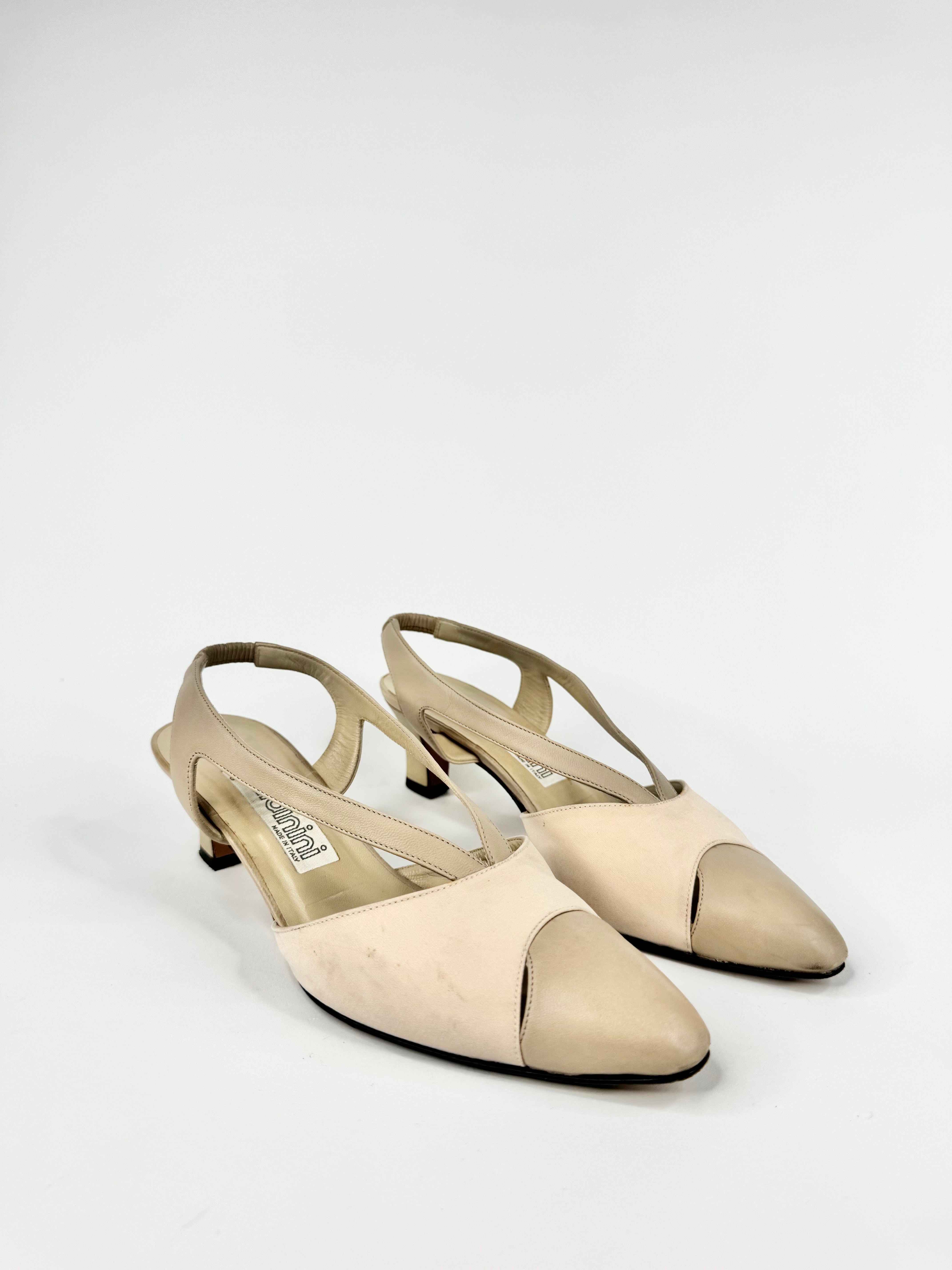 Pair of beige slingback shoes on a white background