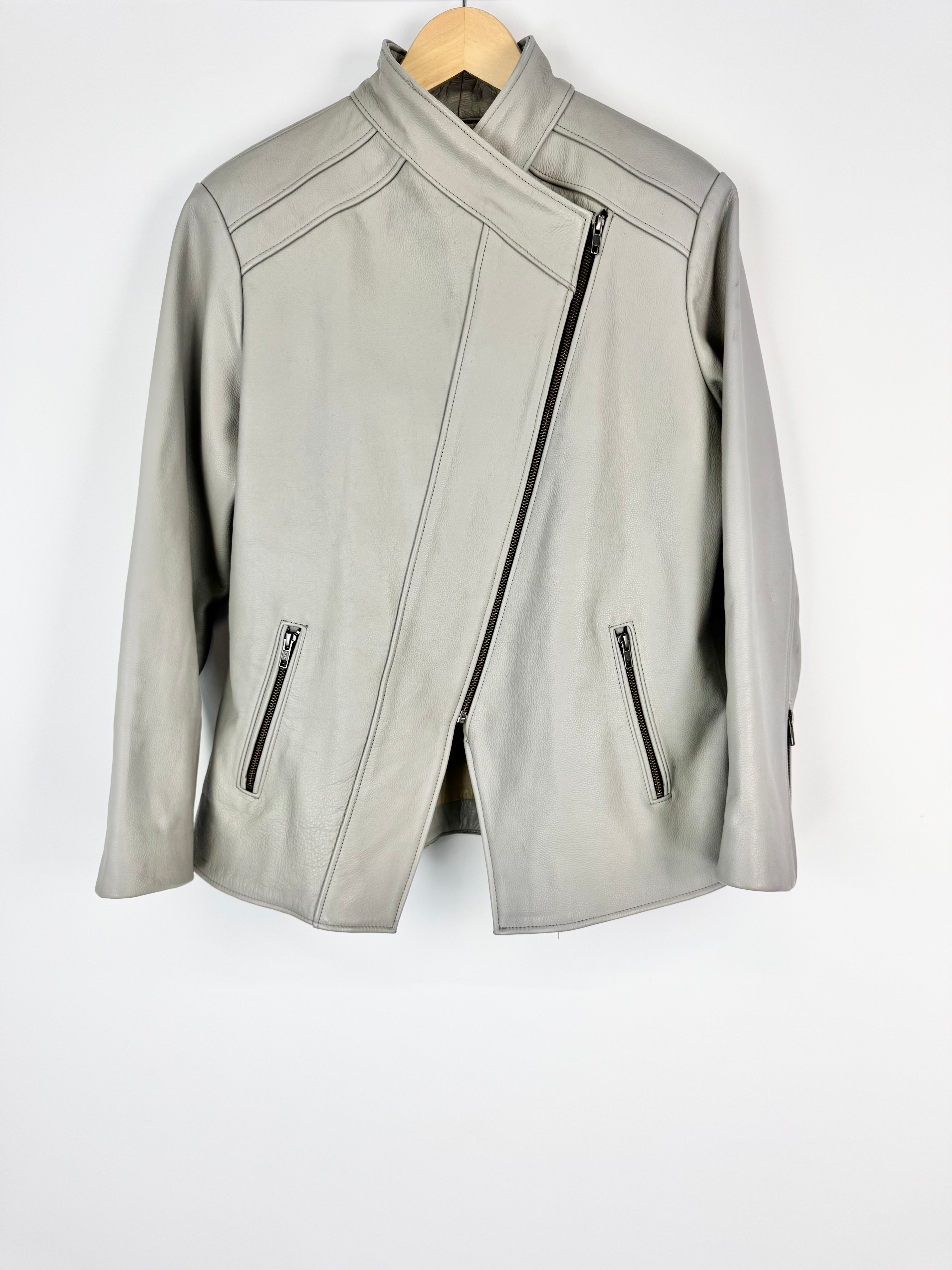 Light gray leather jacket on a white background