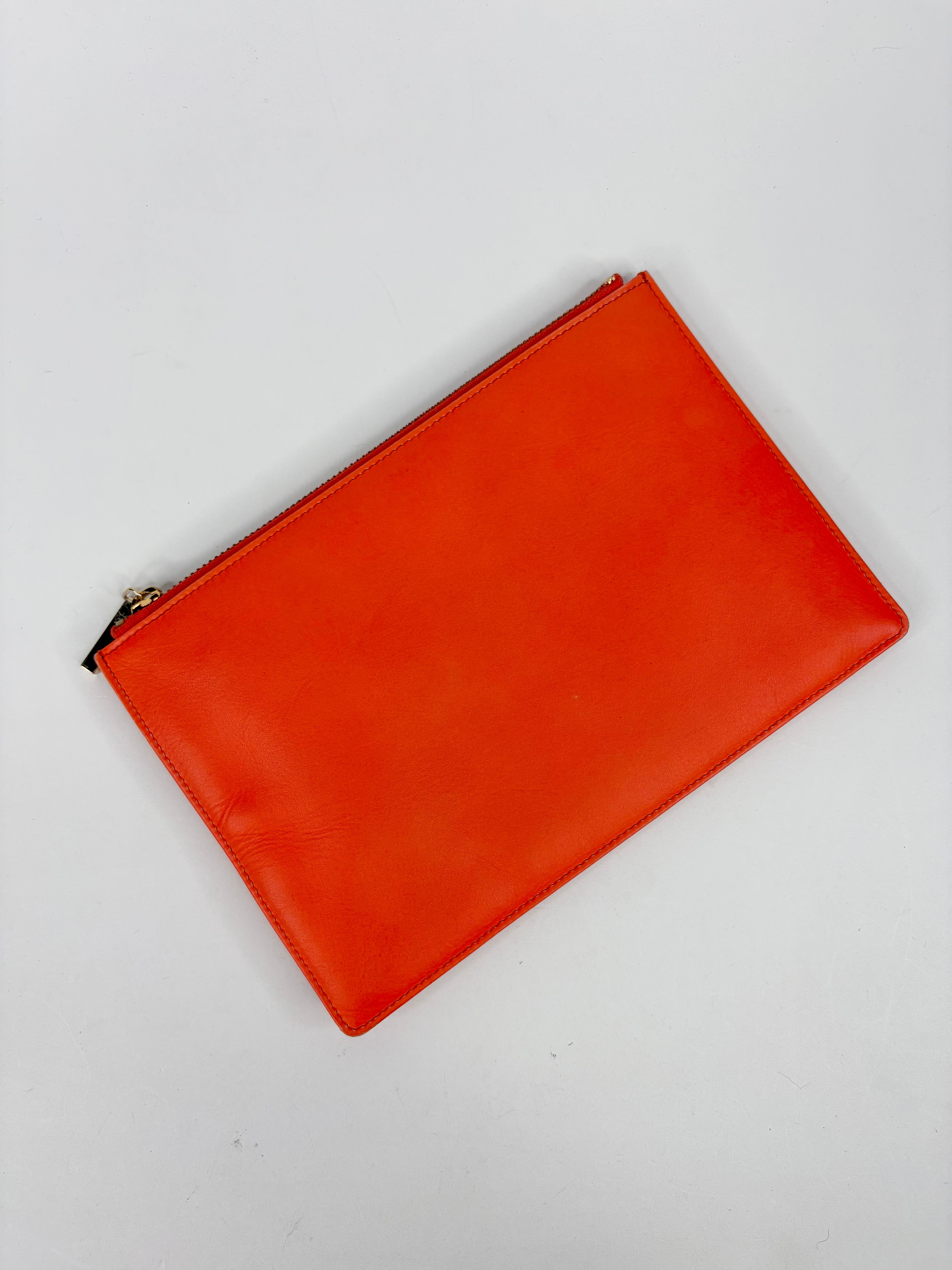 Orange leather pouch on a white background