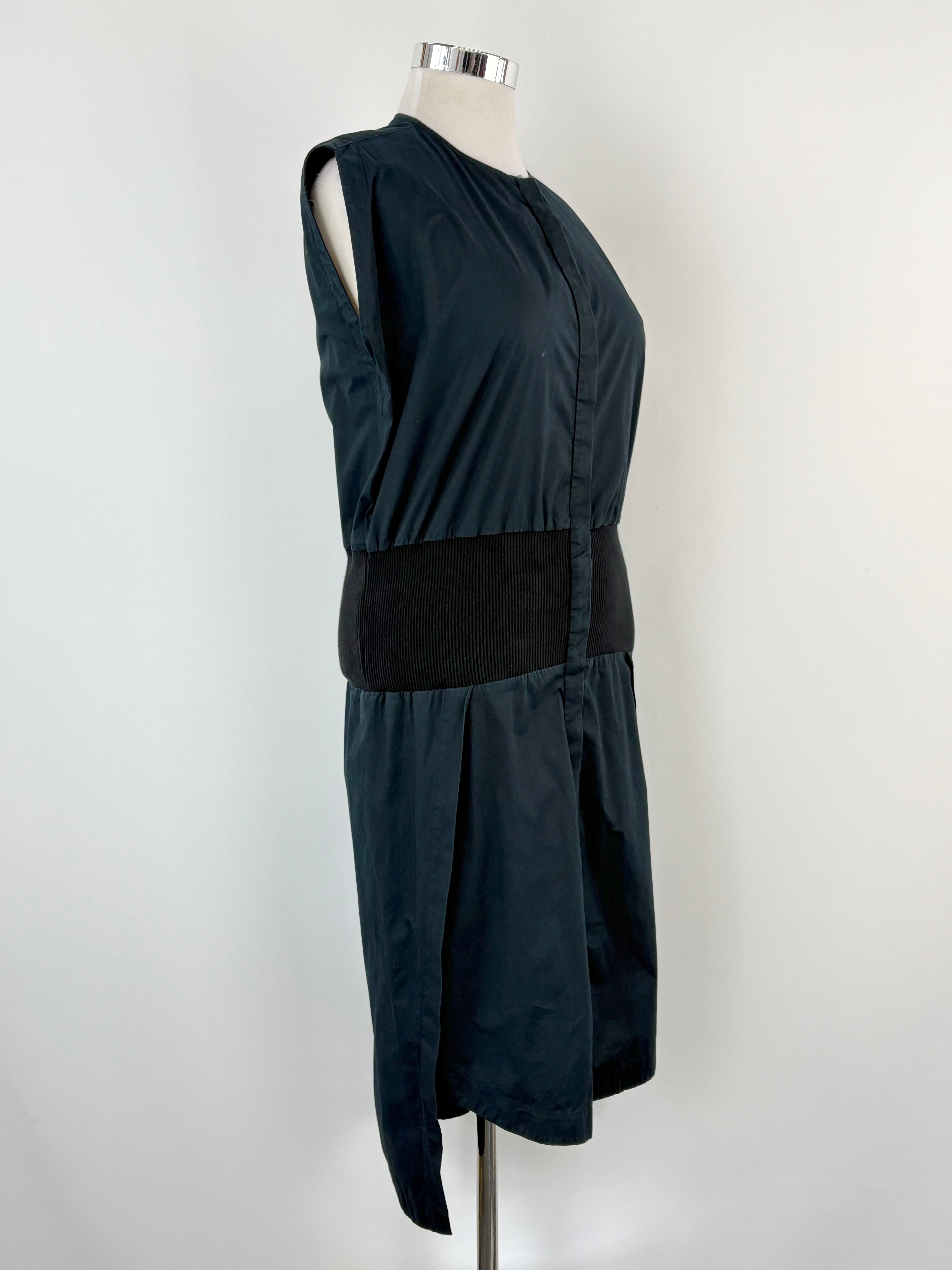 Black sleeveless top and skirt set on a mannequin against a white background