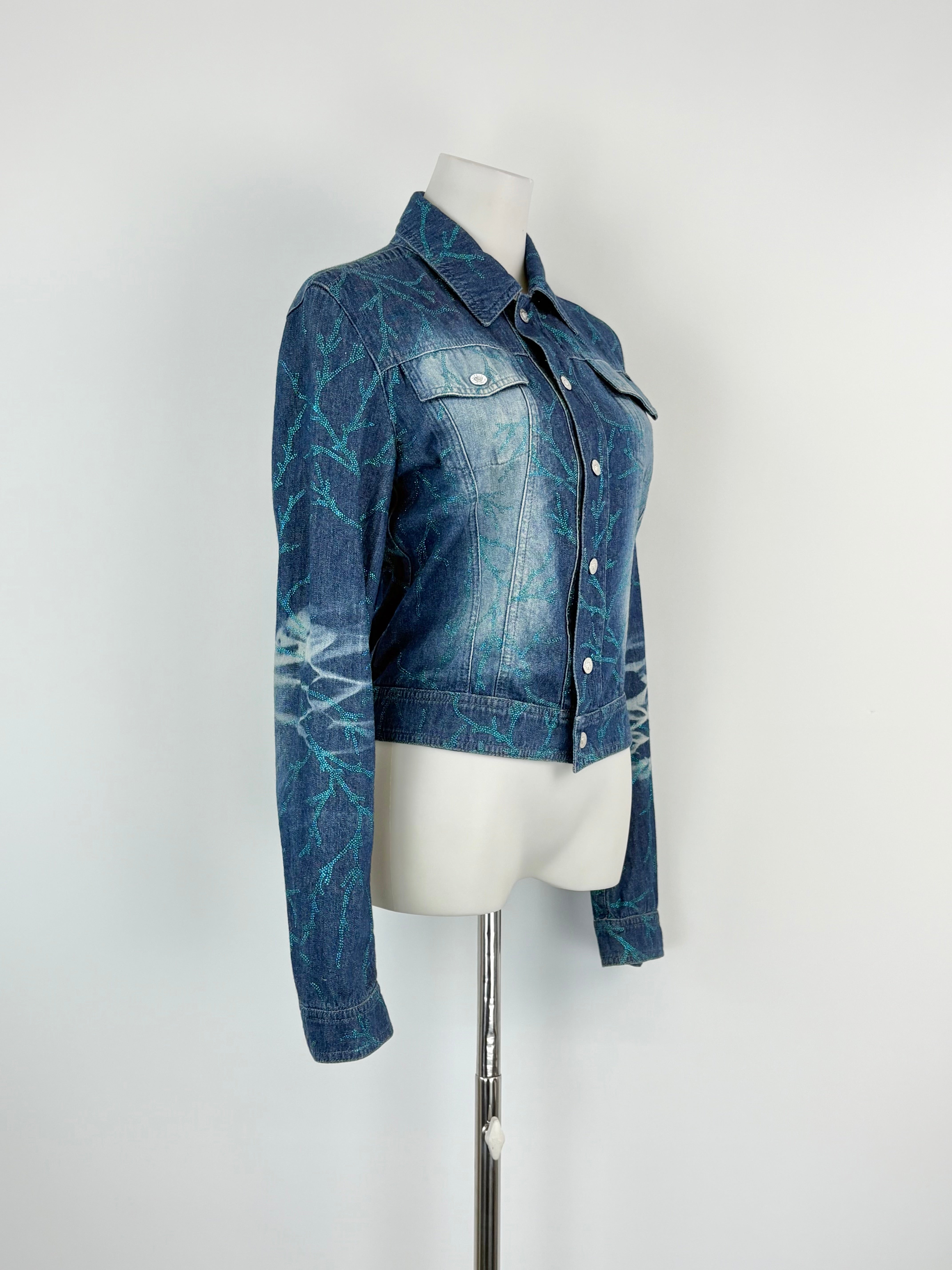 Blue denim jacket on a mannequin against a white background